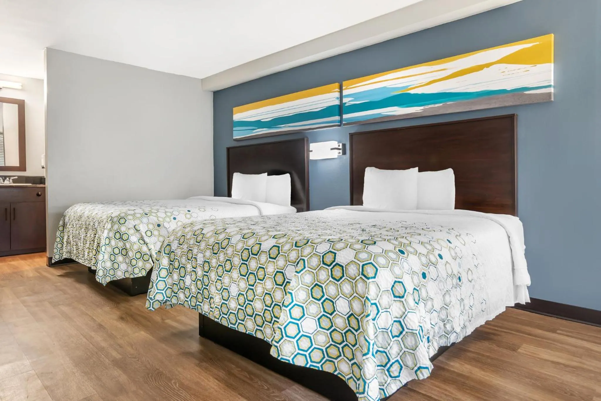 Bedroom, Bed in HomeTowne Studios by Red Roof Montgomery - Midtown