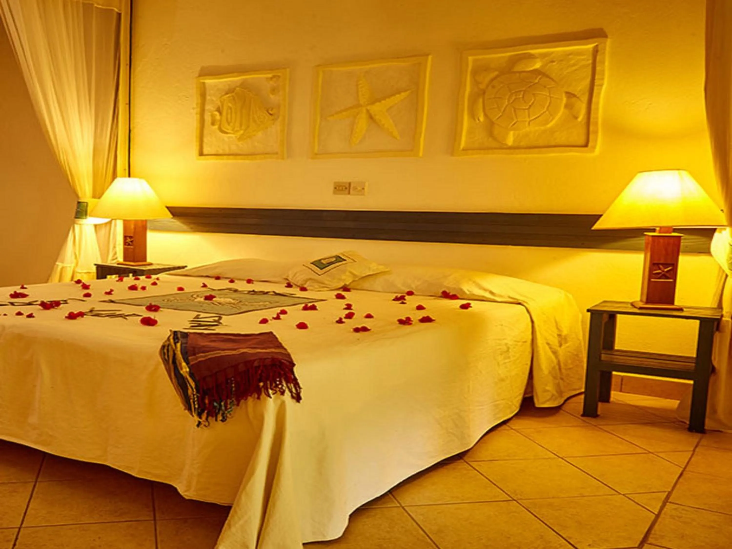 Bed in Pinewood Beach Resort and Spa