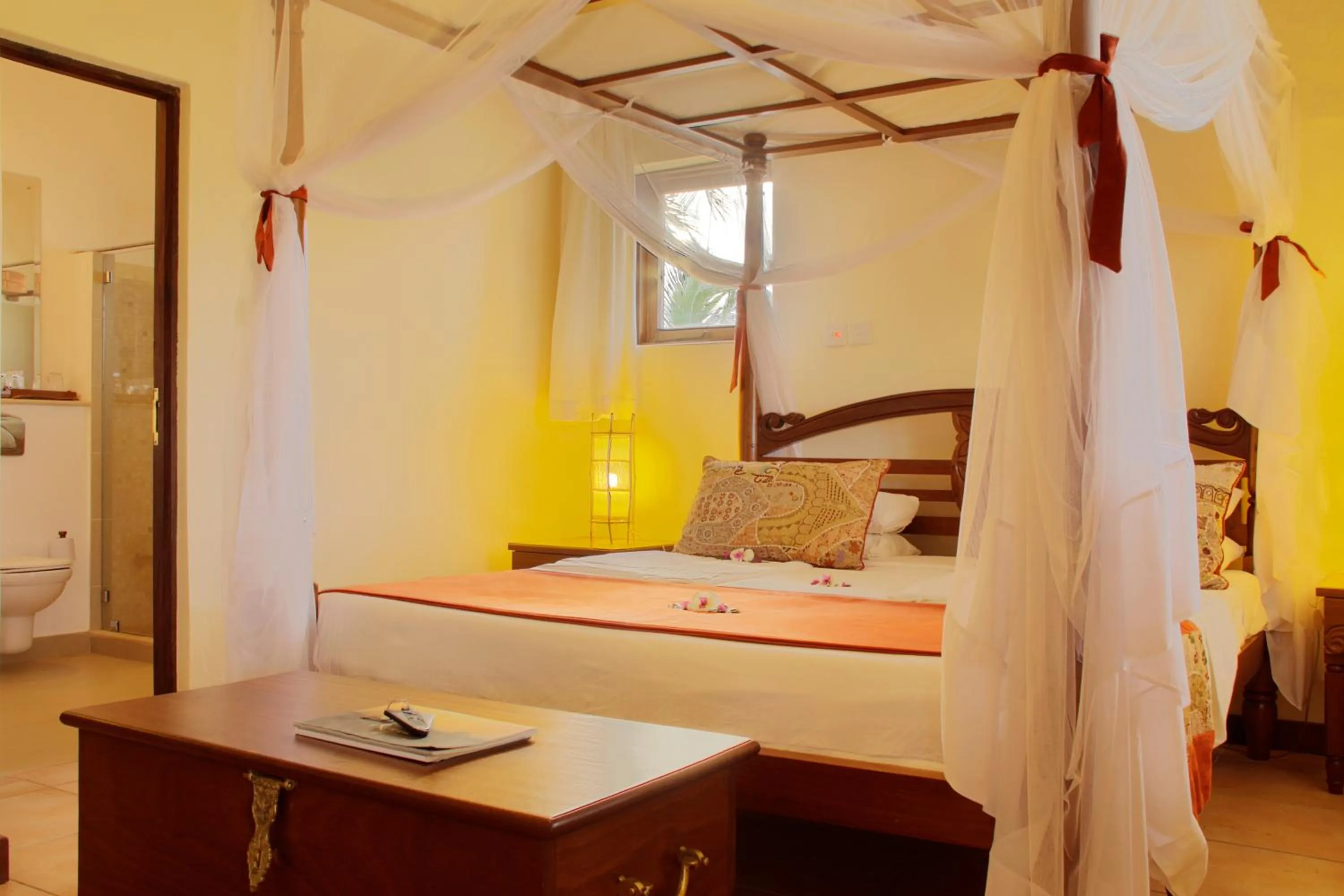 Bed in Pinewood Beach Resort and Spa