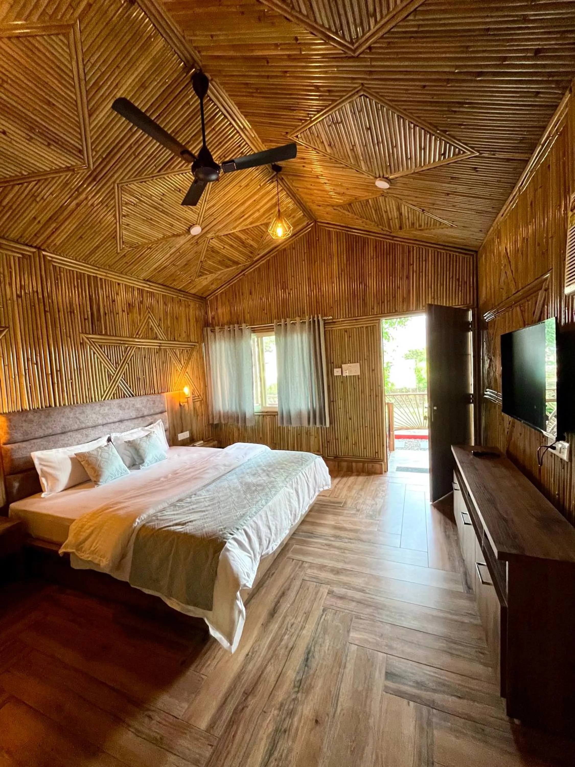 Bed in Bamboo Garden Cottages and Cafe