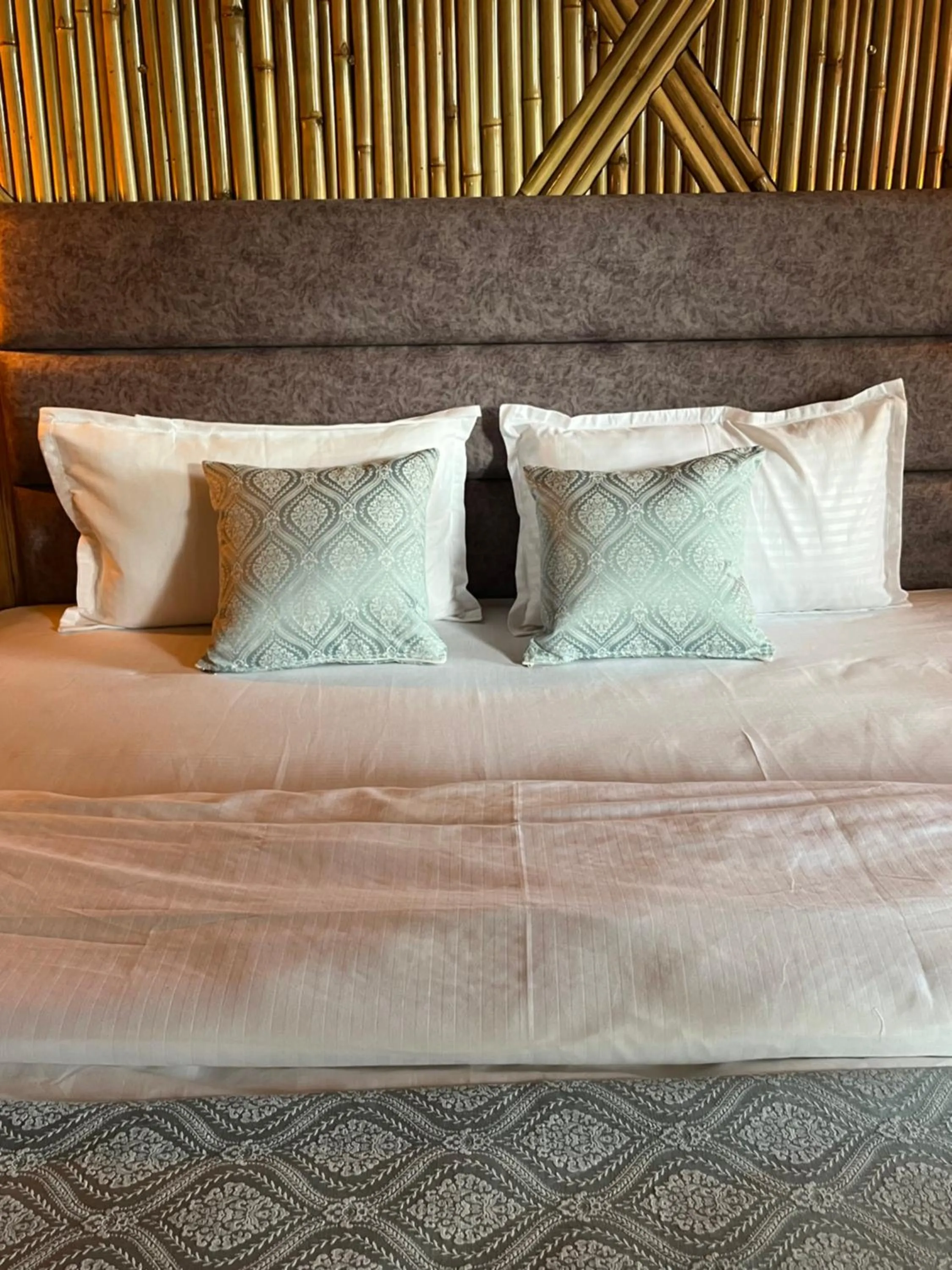 Bed in Bamboo Garden Cottages and Cafe