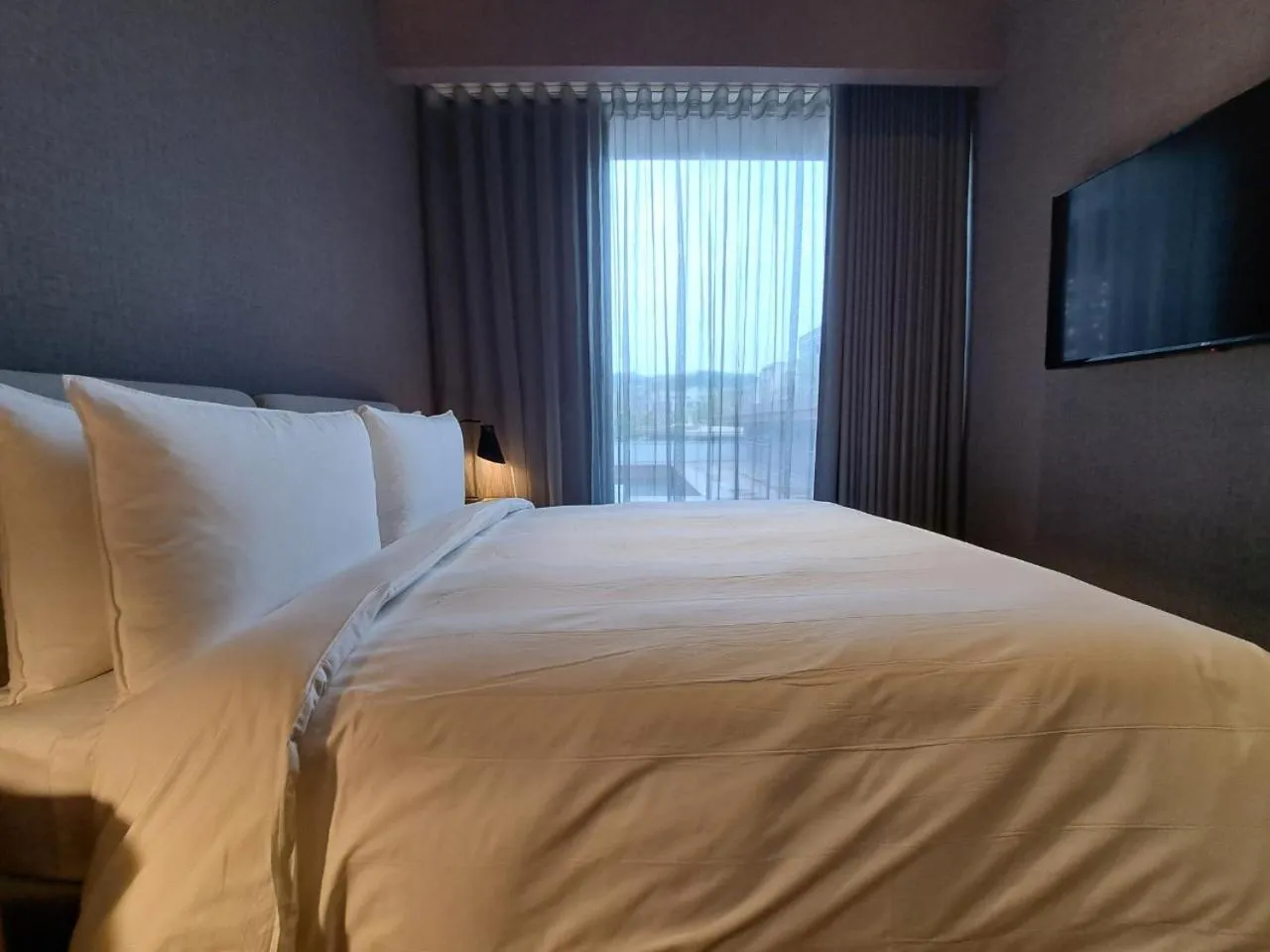 Bed in Boutech Wuri Village Hotel