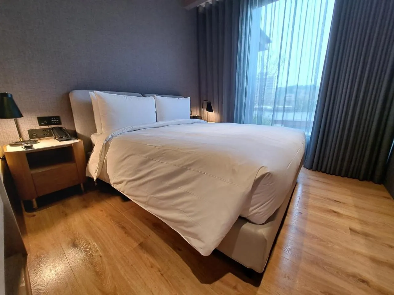 Bed in Boutech Wuri Village Hotel