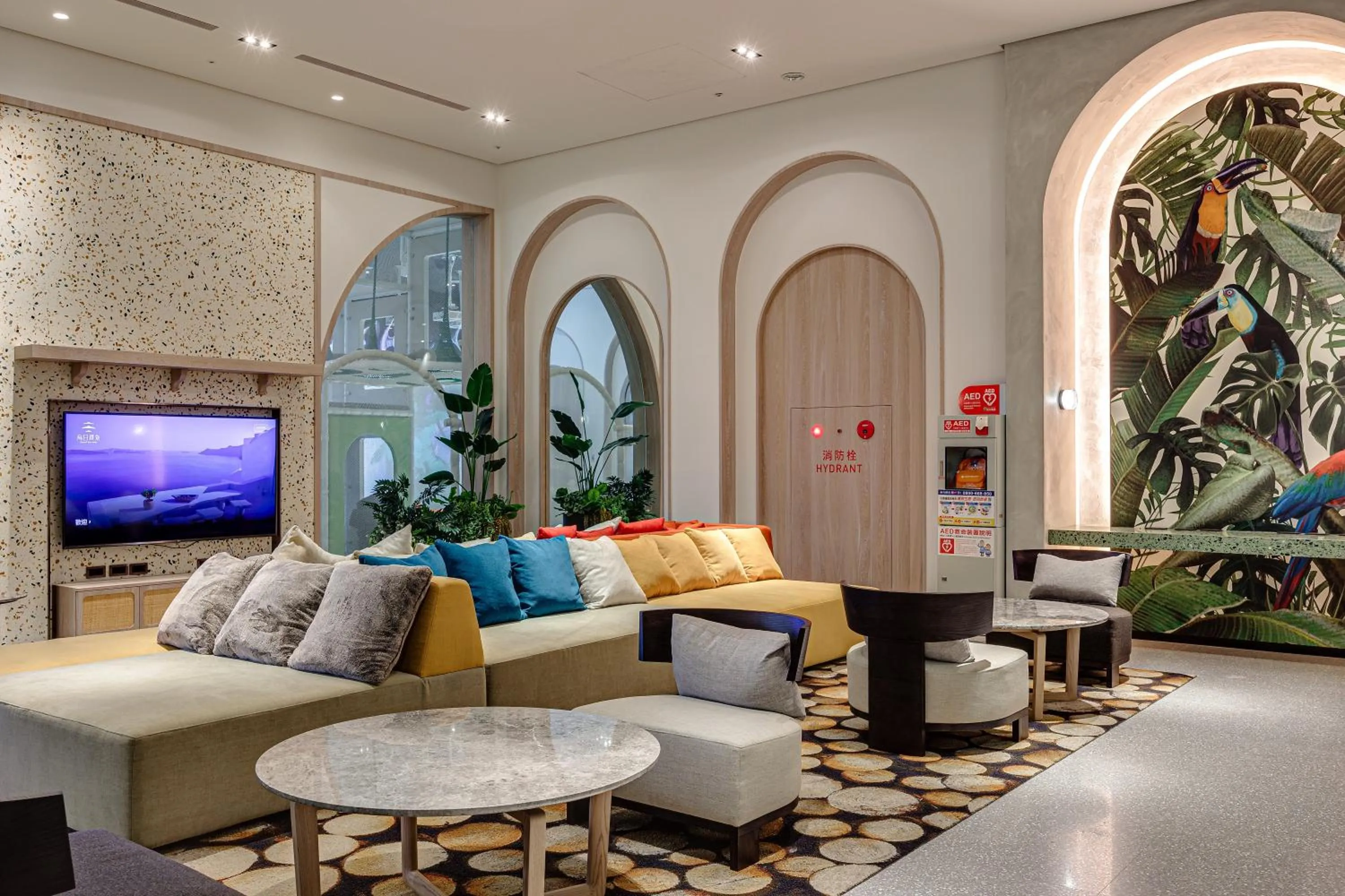 Communal lounge/ TV room in Boutech Wuri Village Hotel