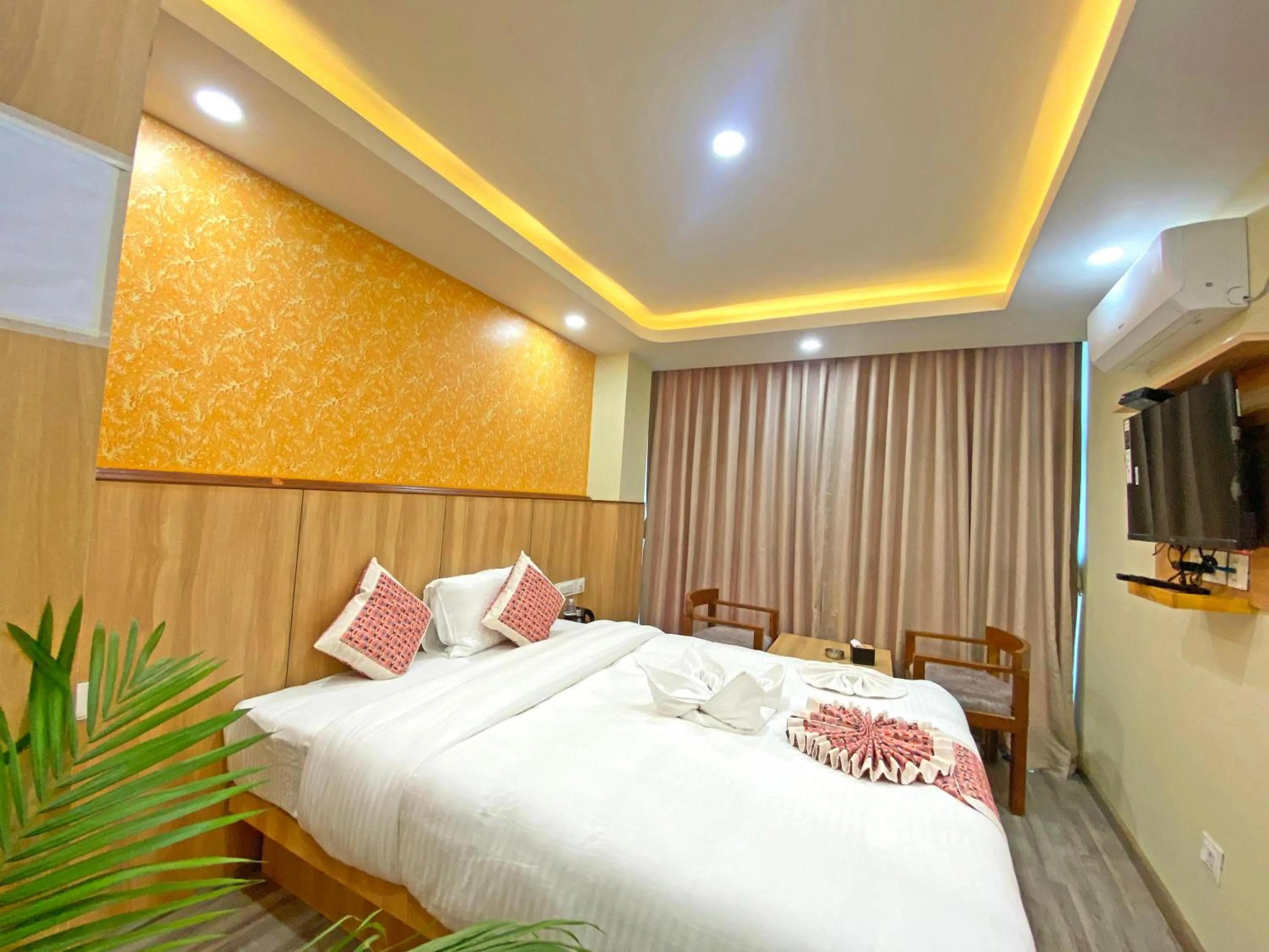 Communal lounge/ TV room, Bed in Hotel Lumbini Airport