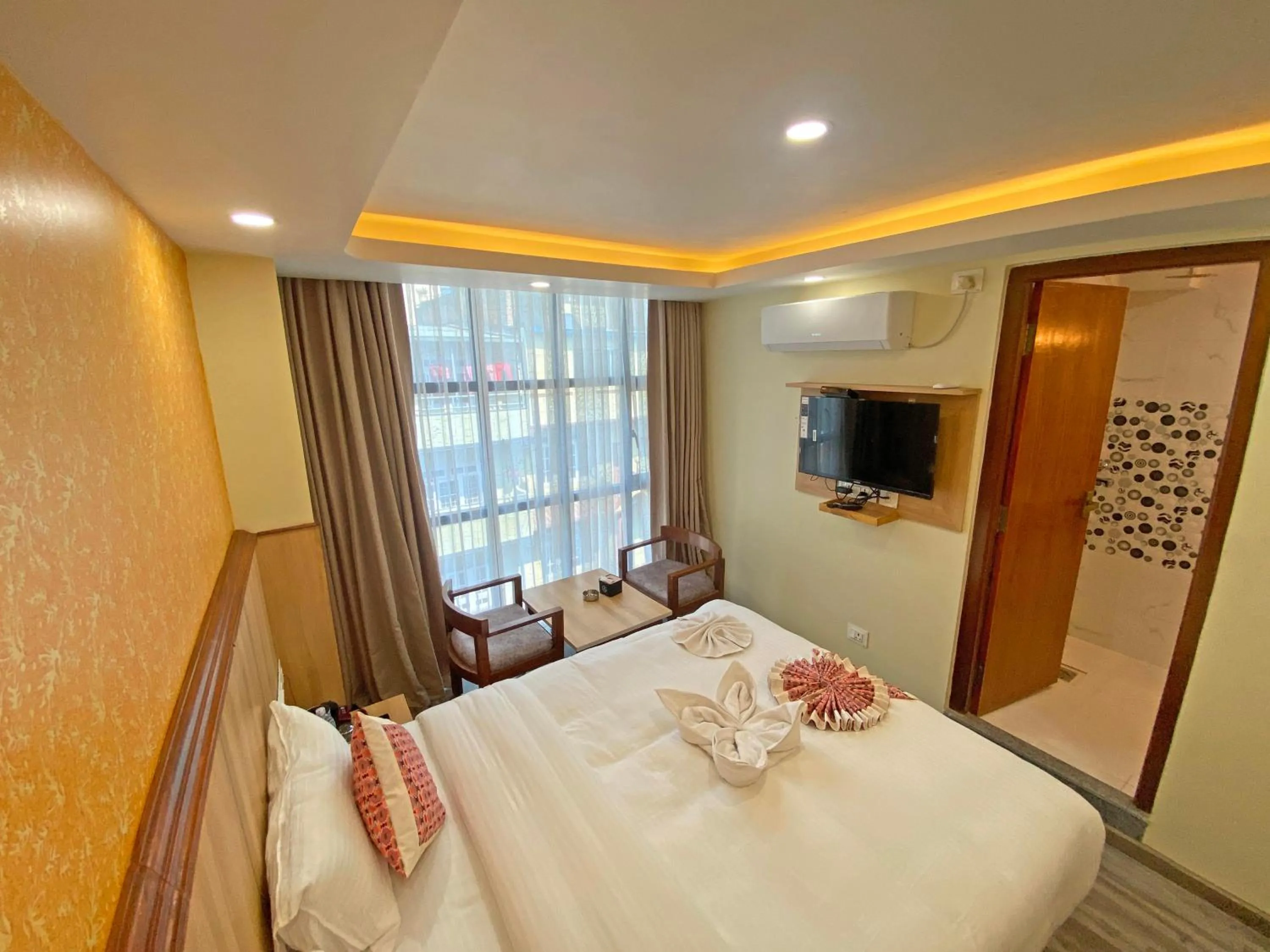 Communal lounge/ TV room, Bed in Hotel Lumbini Airport