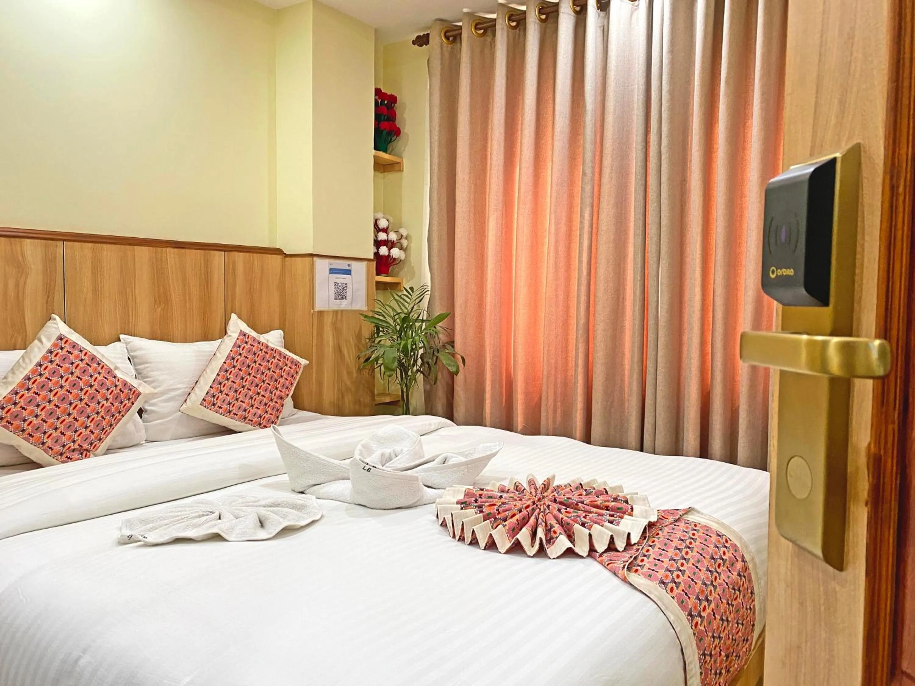 Communal lounge/ TV room, Bed in Hotel Lumbini Airport