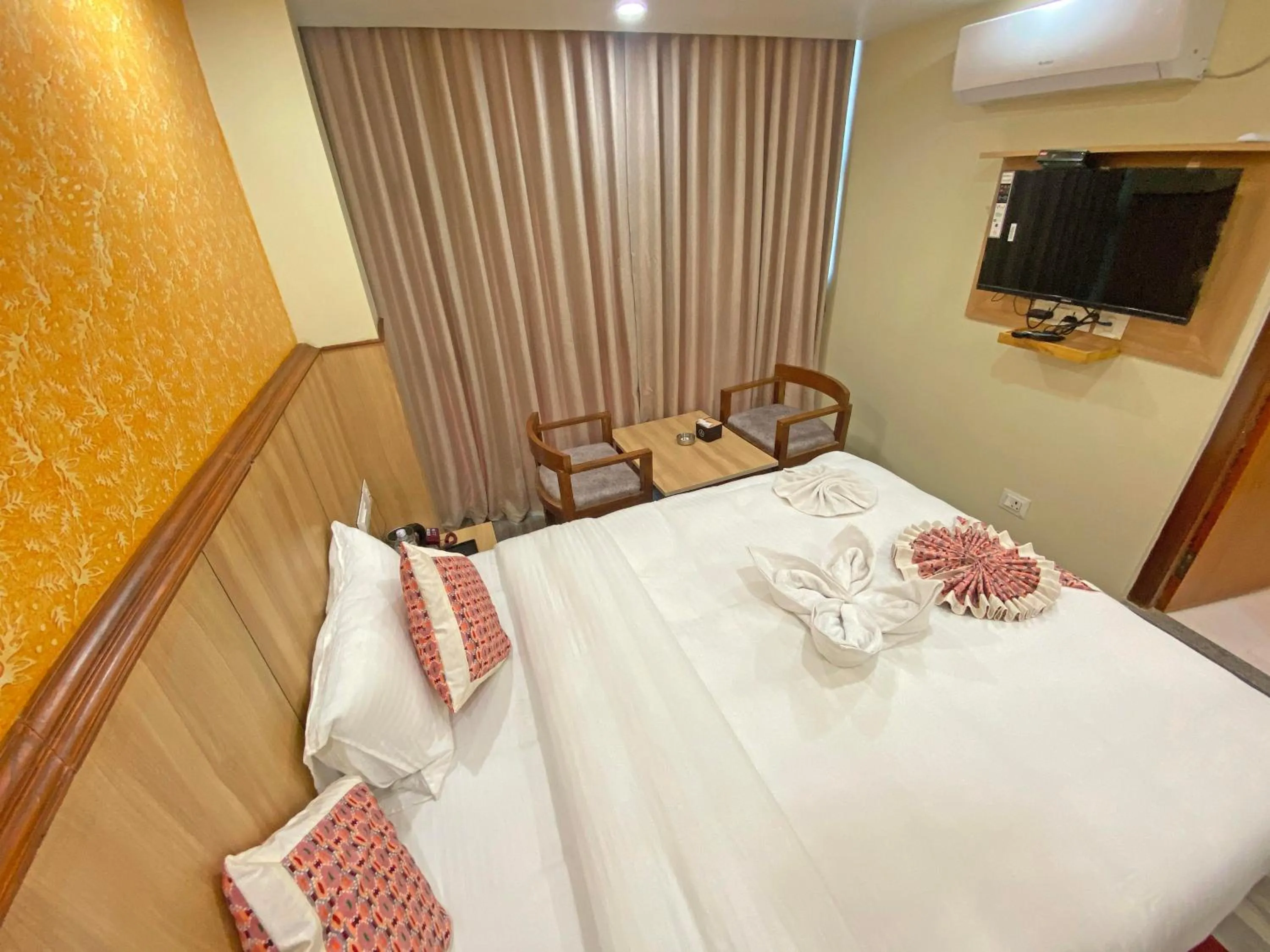 Communal lounge/ TV room, Bed in Hotel Lumbini Airport