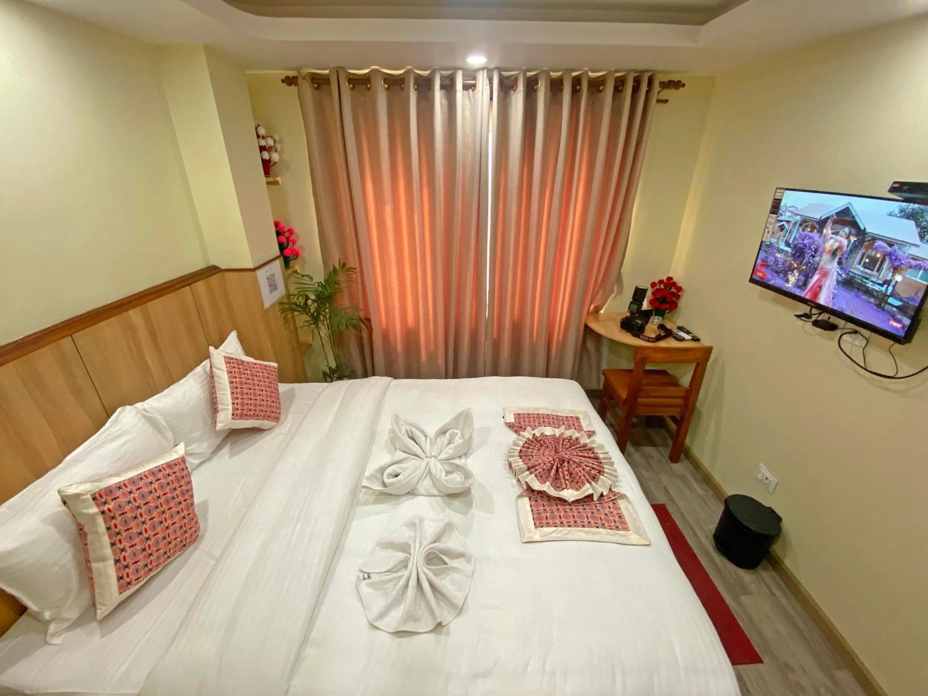 Communal lounge/ TV room, Bed in Hotel Lumbini Airport