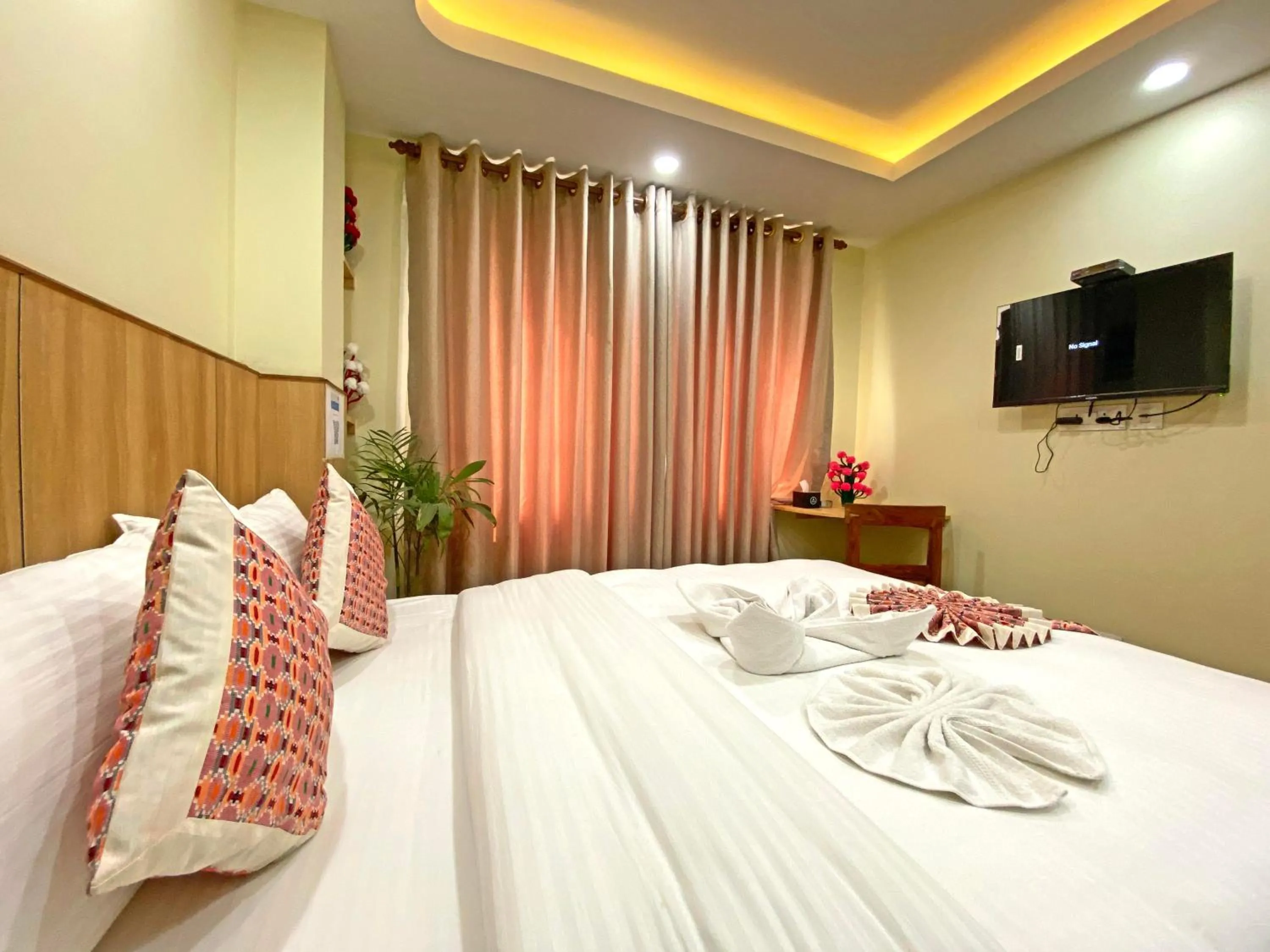 Communal lounge/ TV room, Bed in Hotel Lumbini Airport