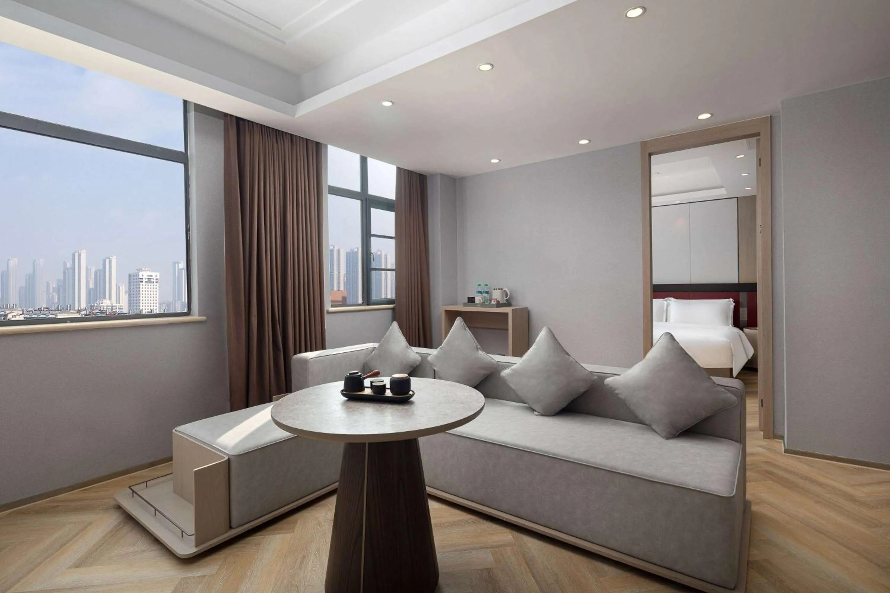 Living room in Ramada by Wyndham Wuhan Wangjiawan