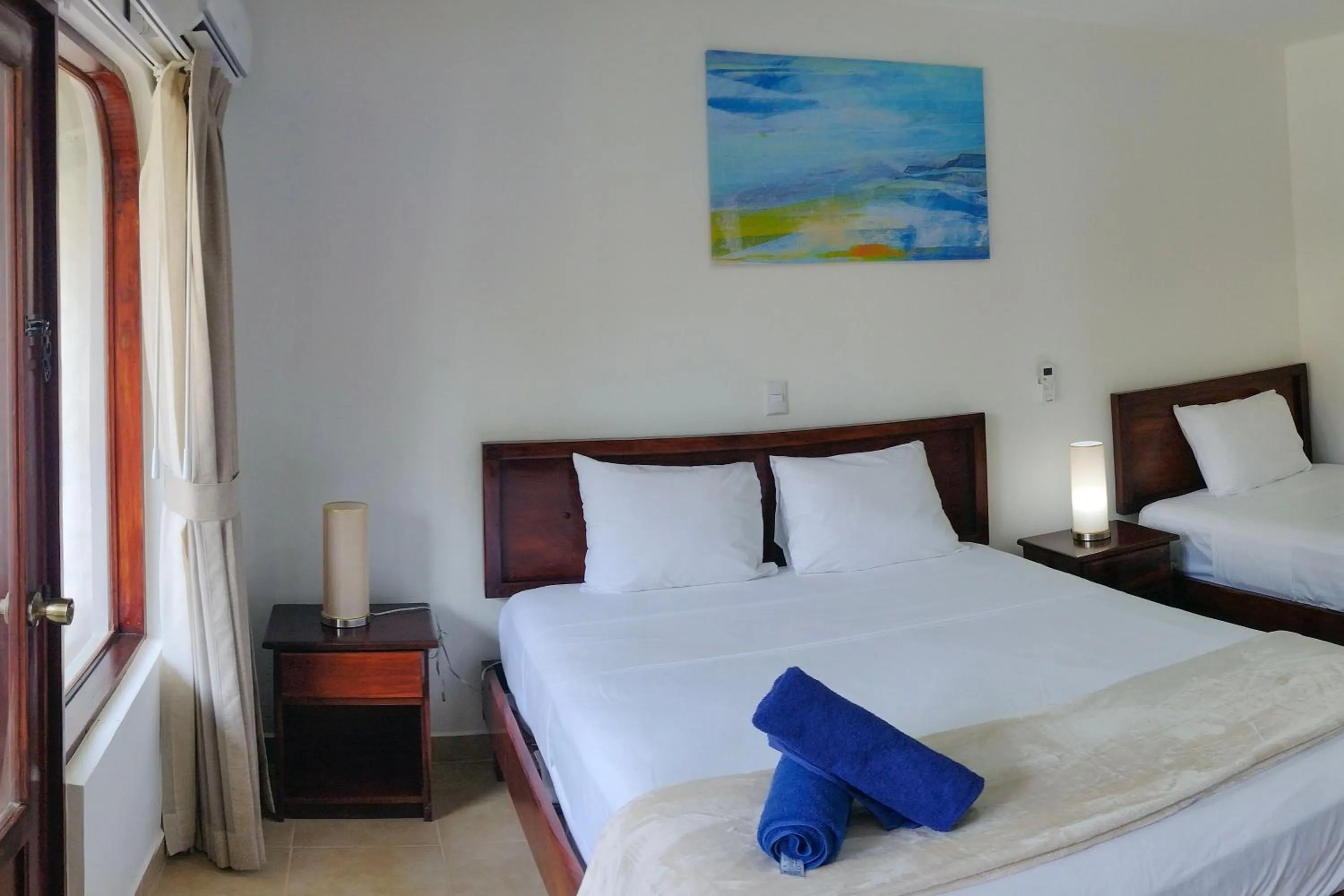 Bed in Fuego del Sol Beachfront Hotel