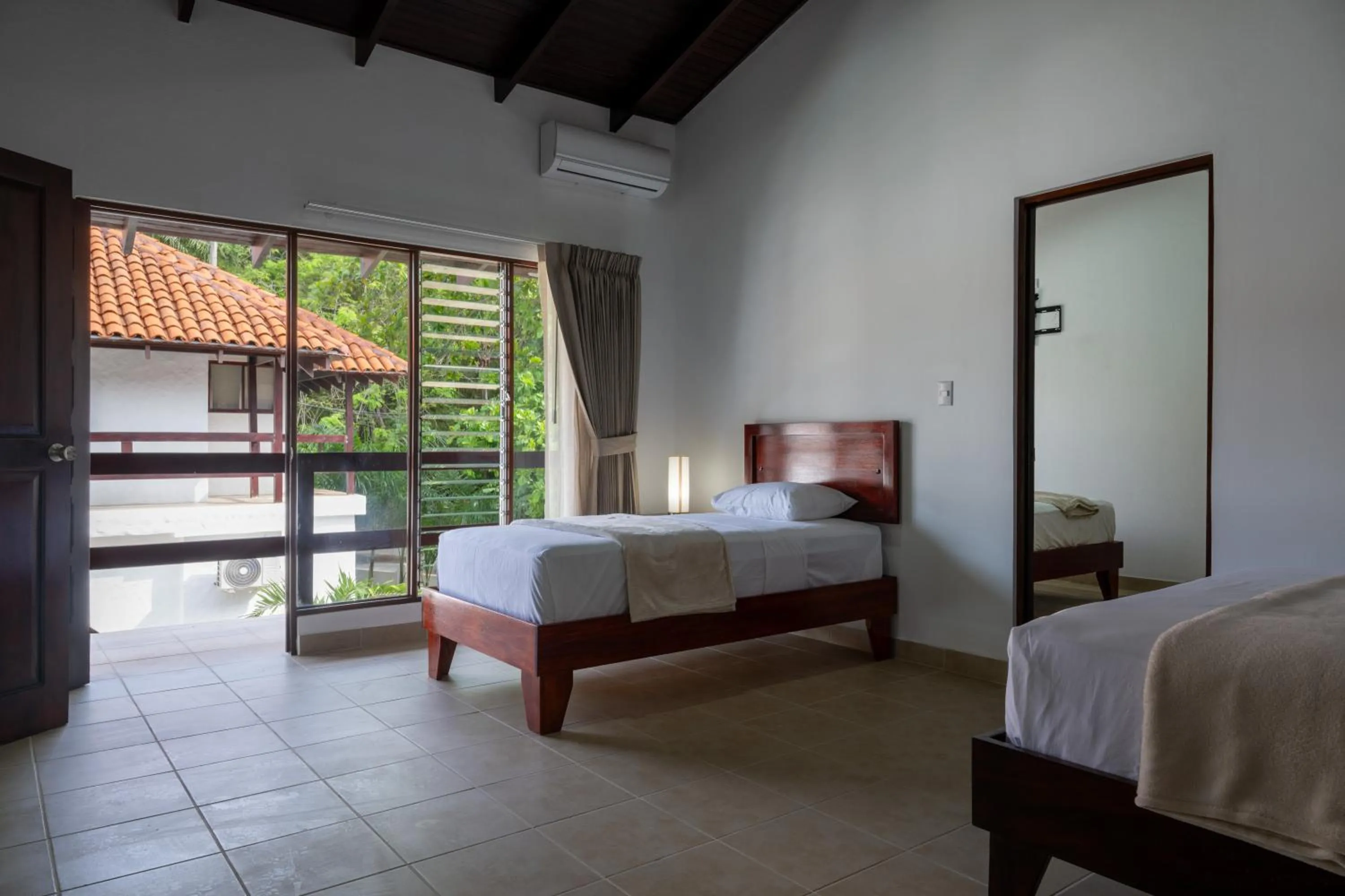 Bedroom, Bed in Fuego del Sol Beachfront Hotel