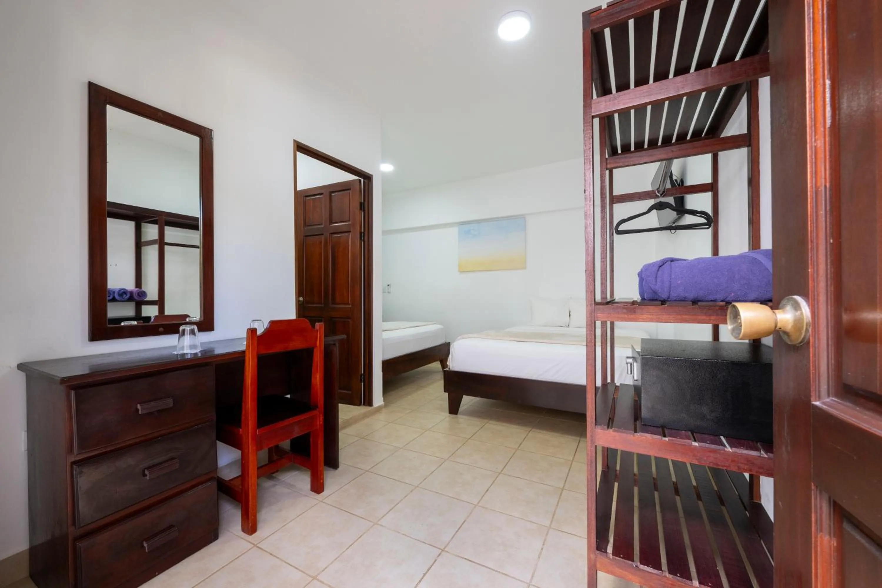 Bed in Fuego del Sol Beachfront Hotel