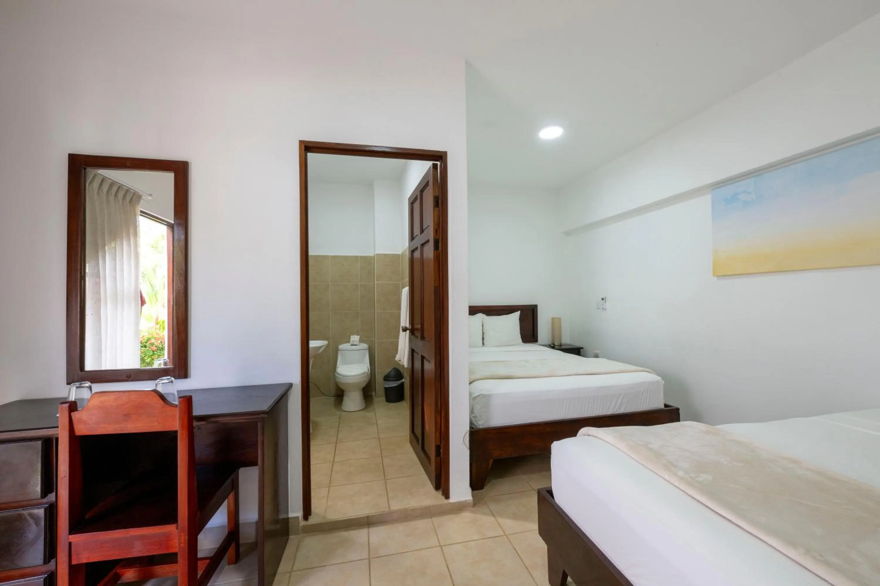 Bed in Fuego del Sol Beachfront Hotel