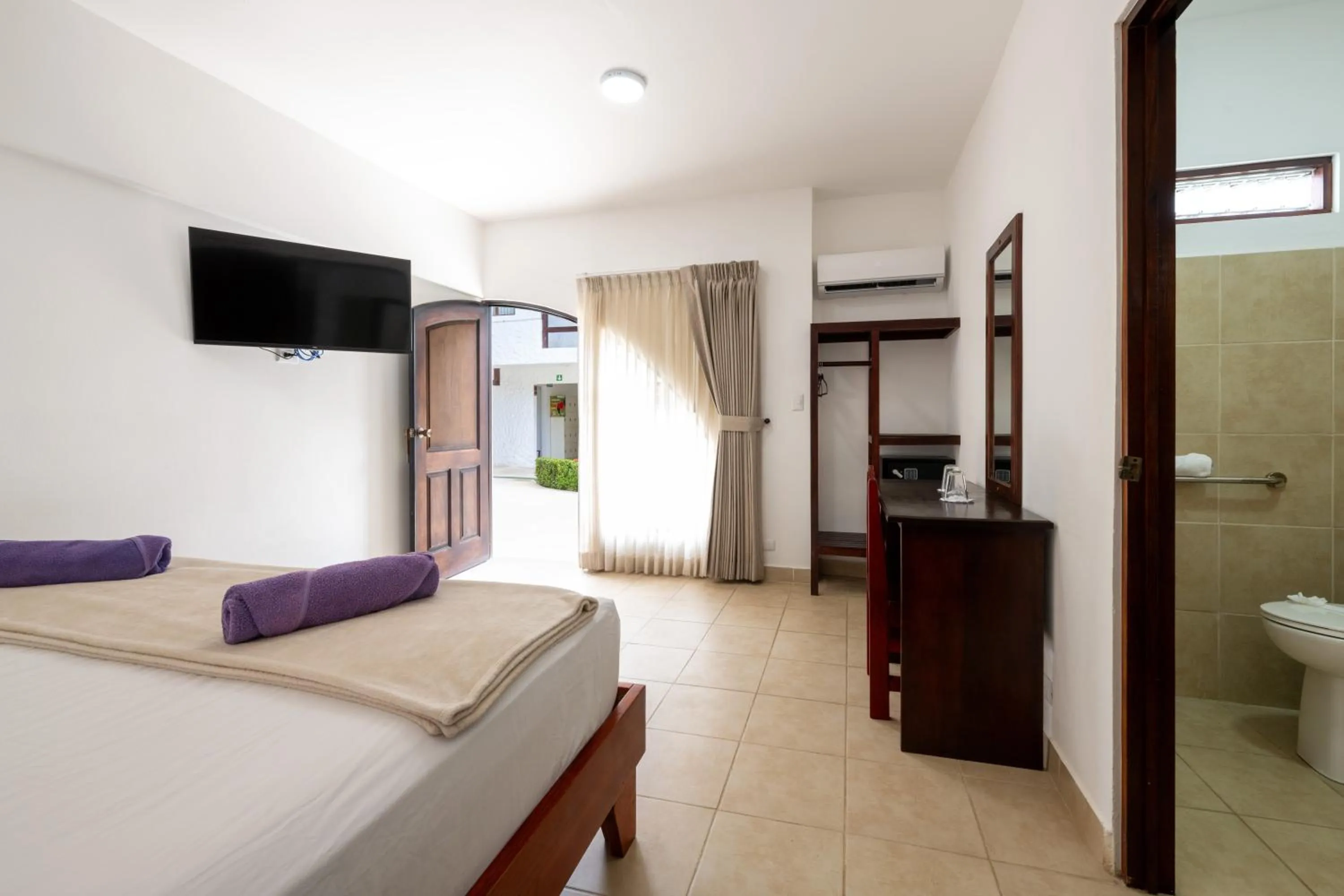 Bed in Fuego del Sol Beachfront Hotel