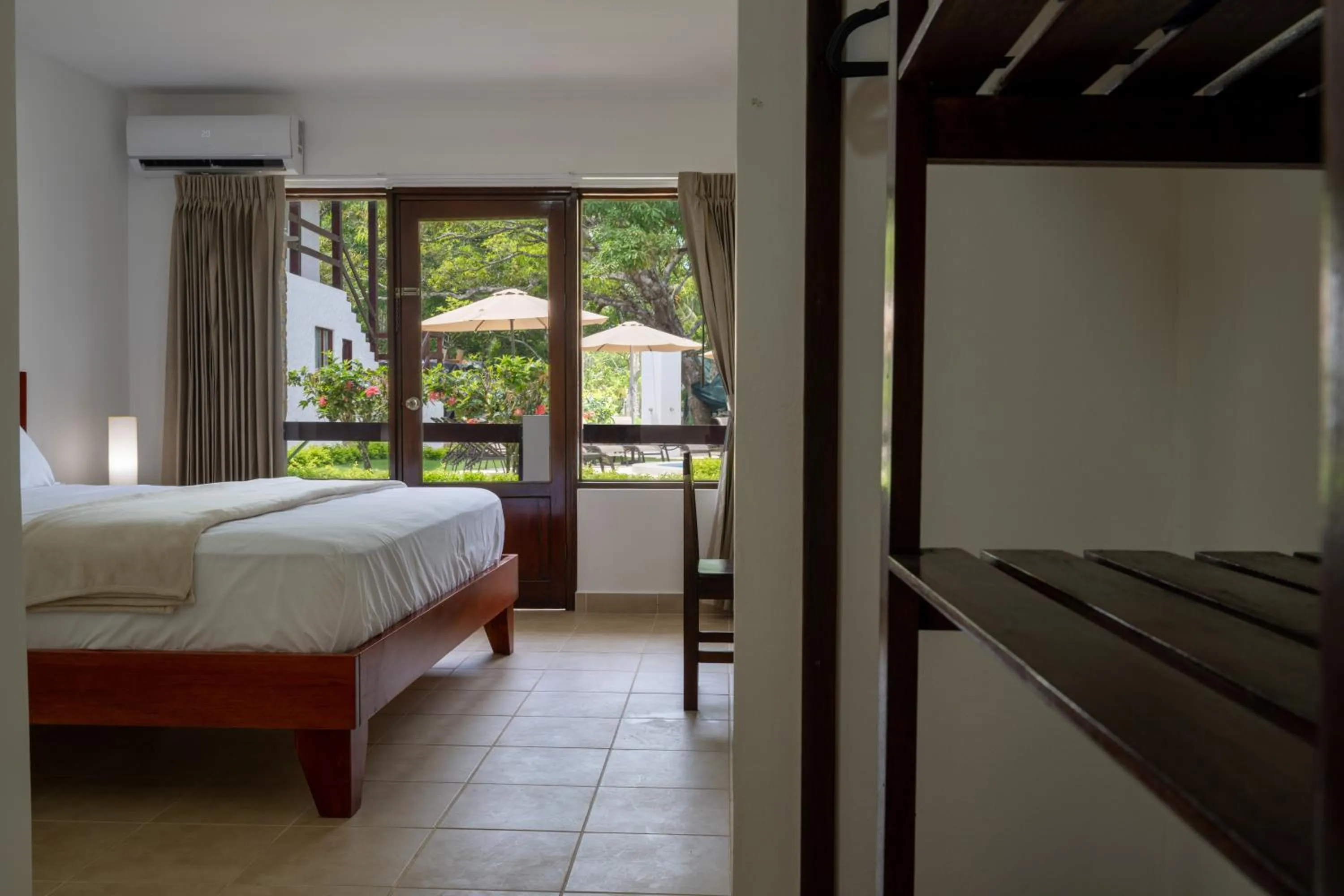 Bedroom, Bed in Fuego del Sol Beachfront Hotel