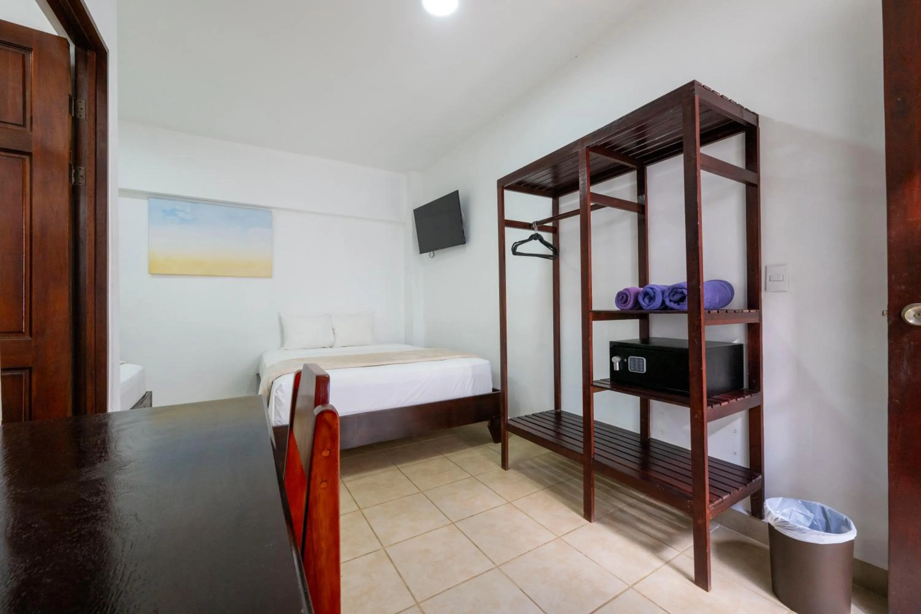 Bed in Fuego del Sol Beachfront Hotel