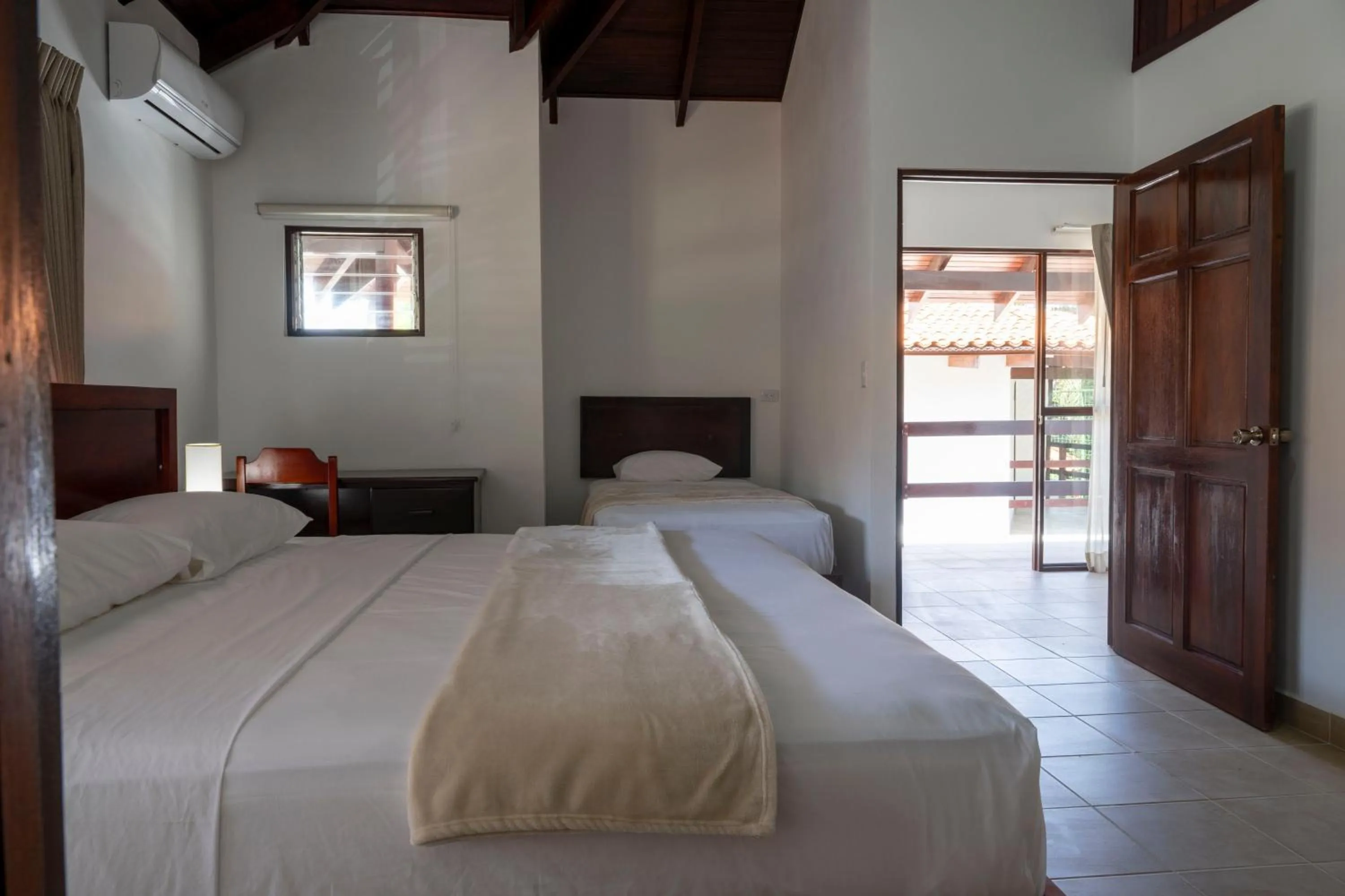 Bedroom, Bed in Fuego del Sol Beachfront Hotel