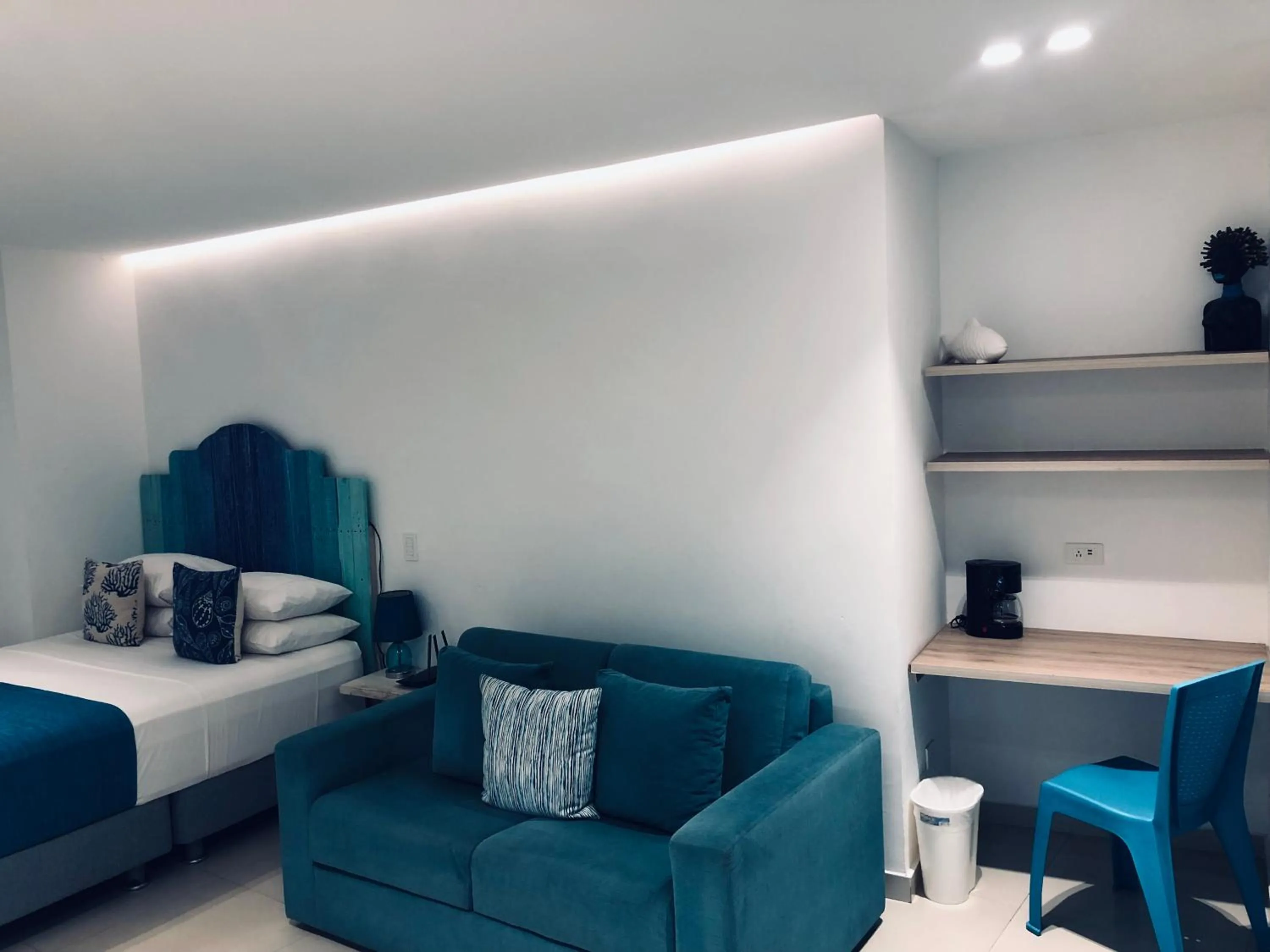 Bed in White Coral ApartaSuites