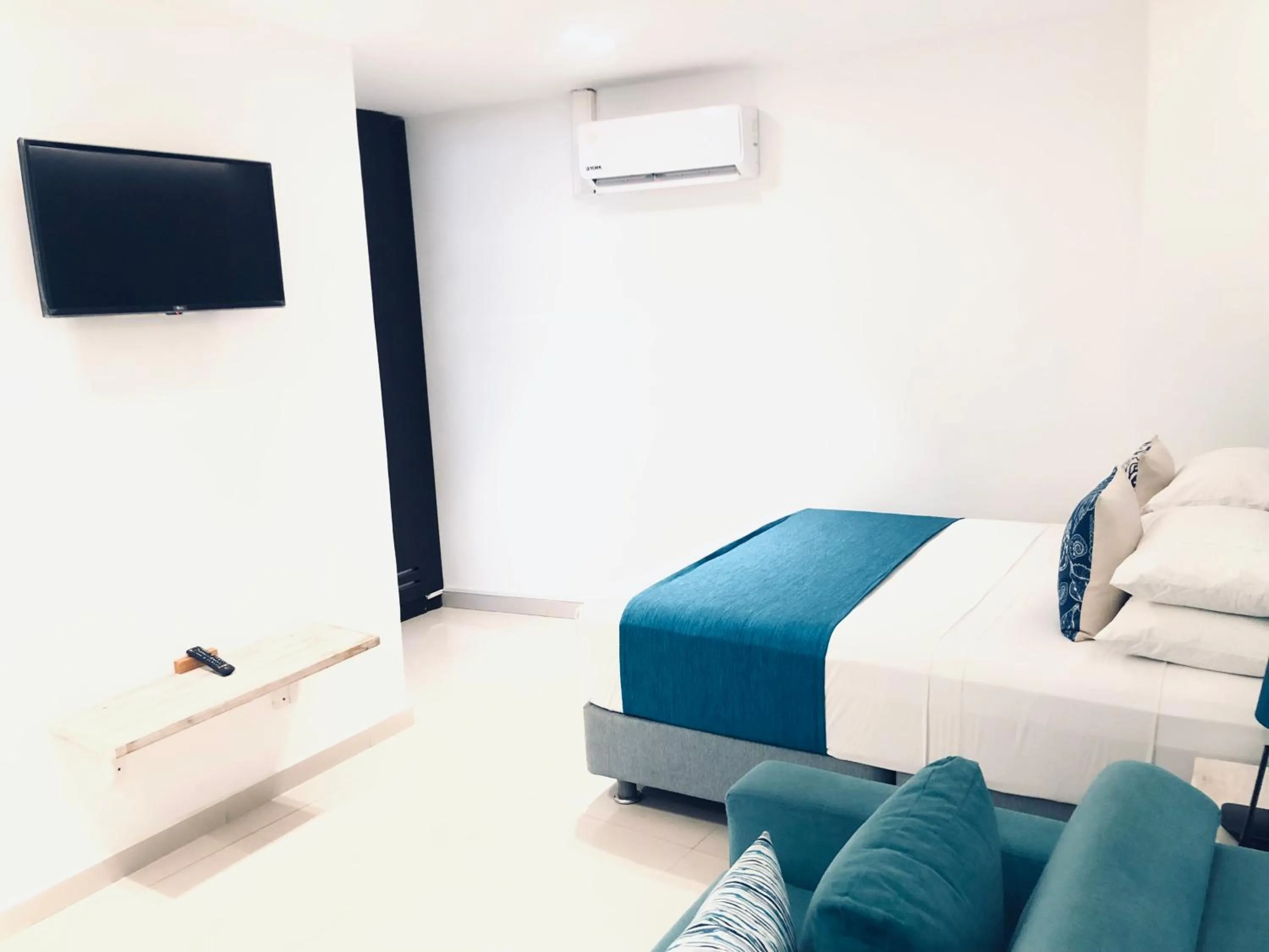 Bedroom in White Coral ApartaSuites