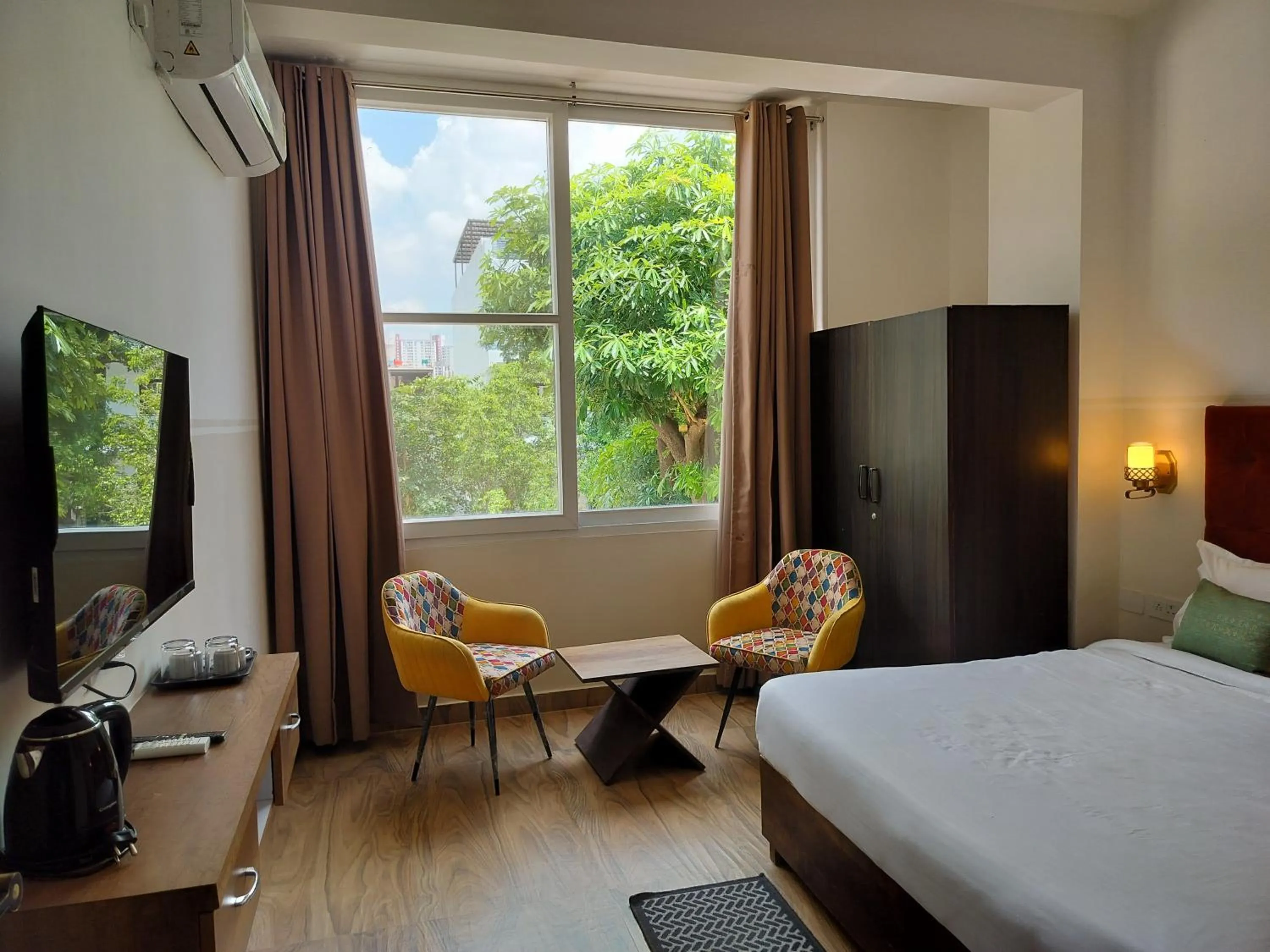 Bedroom, Bed in Saffron Inn - Expo India Mart