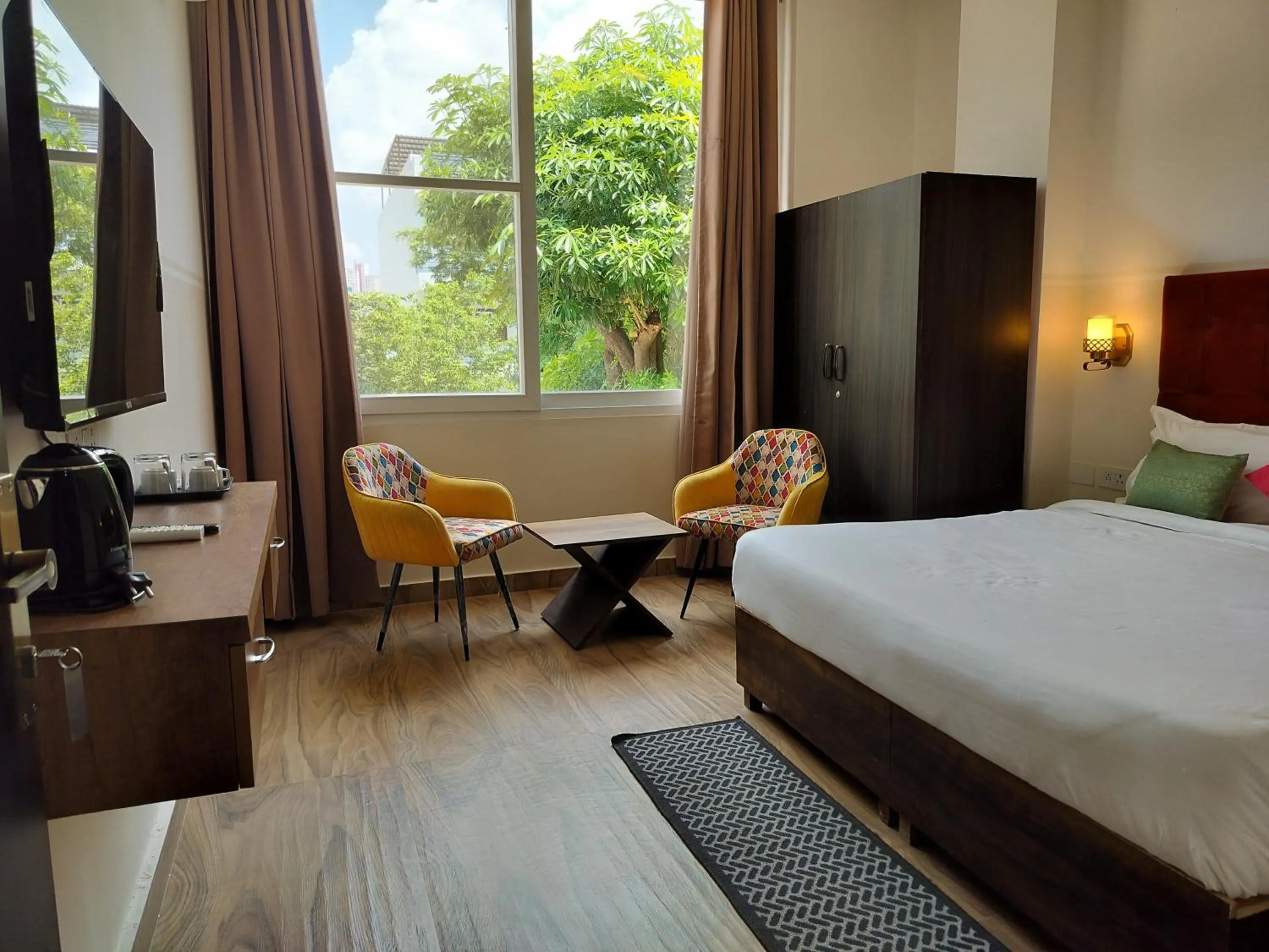 Bedroom, Bed in Saffron Inn - Expo India Mart