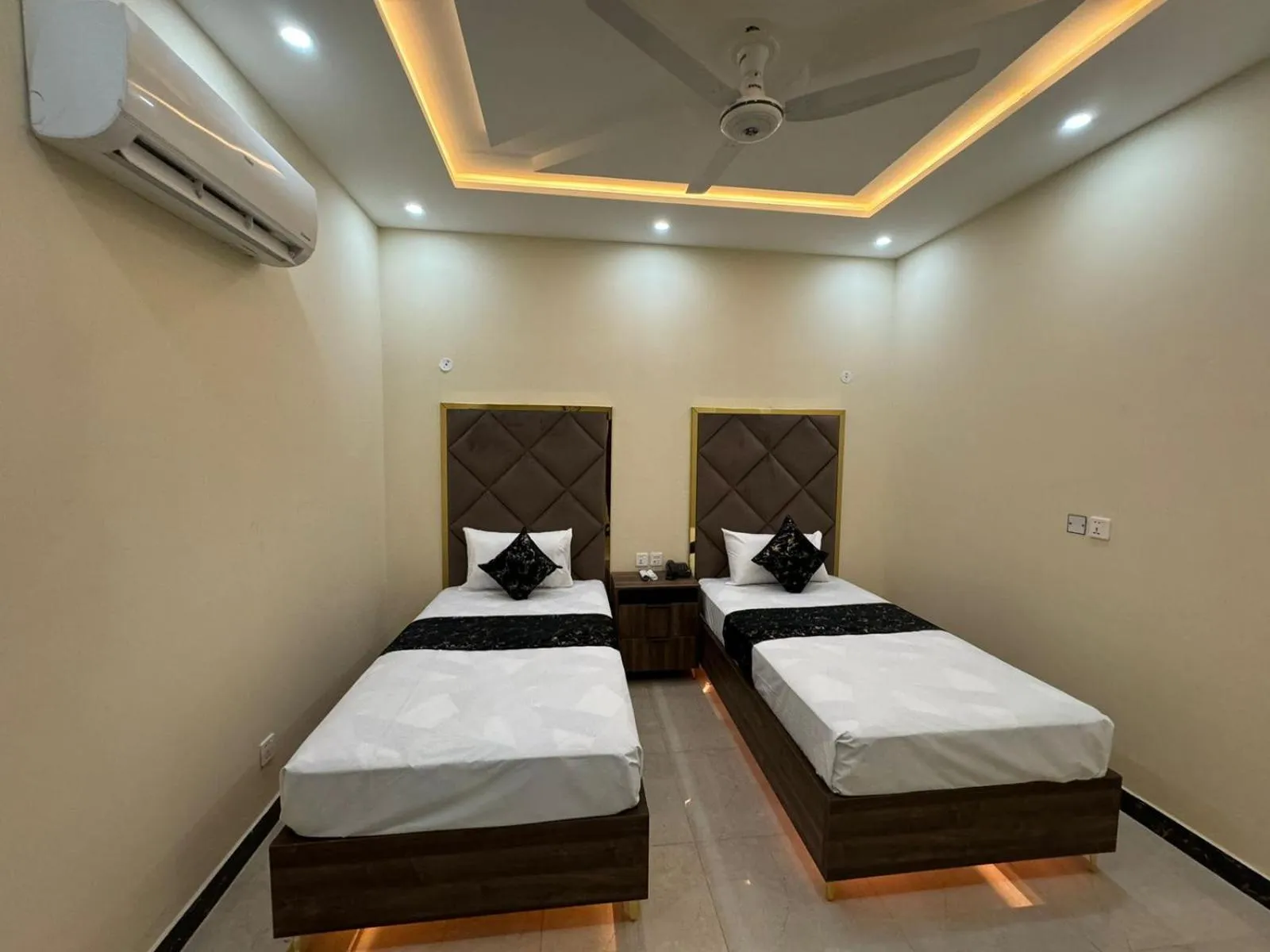 Photo of the whole room, Bed in Gold Pine Hotel Lahore