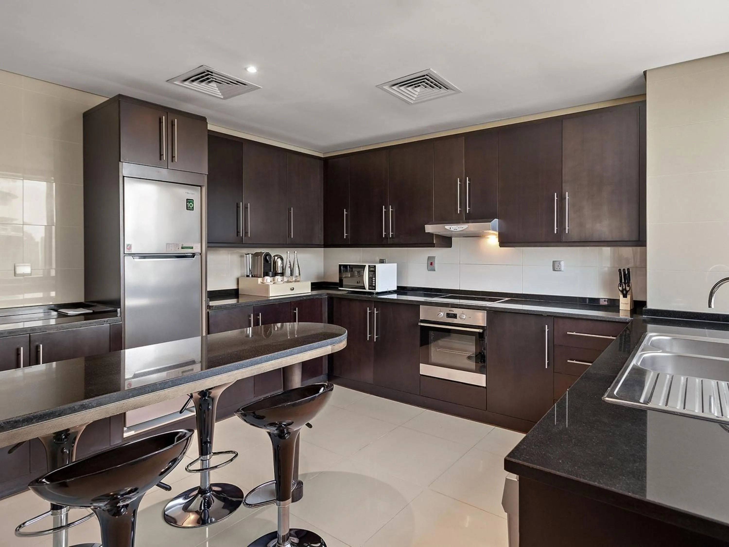Kitchen or kitchenette in Pullman Dubai Jumeirah Lakes Towers