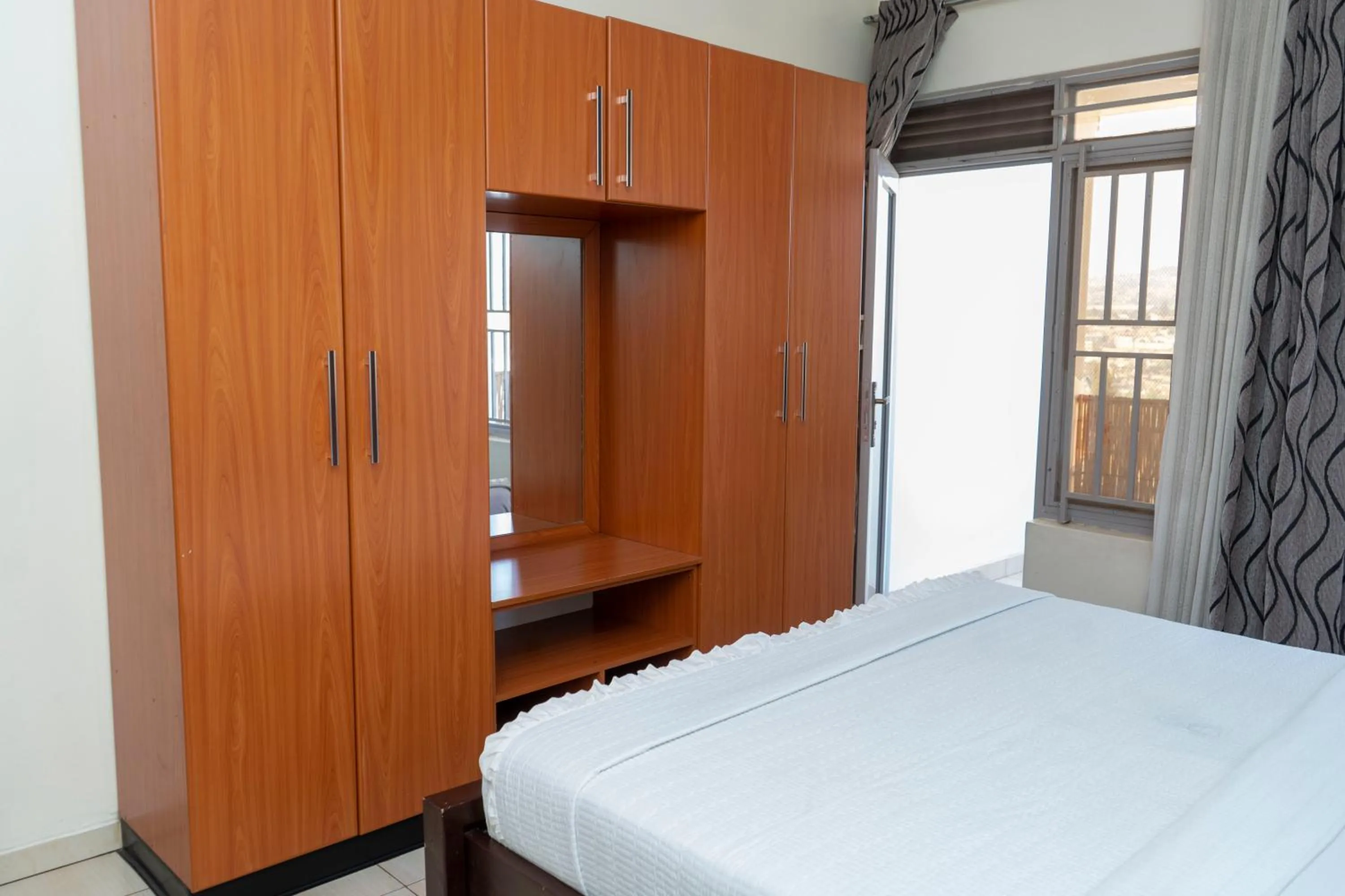 wardrobe, Bed in Green View Apartments