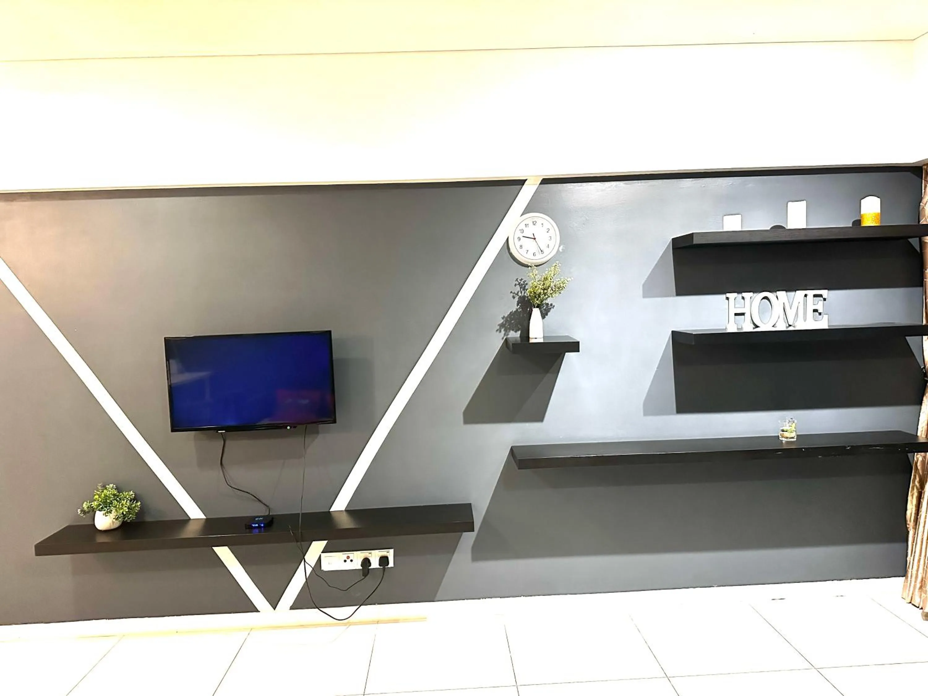 Communal lounge/ TV room in Summer Suites KLCC by Luna KL