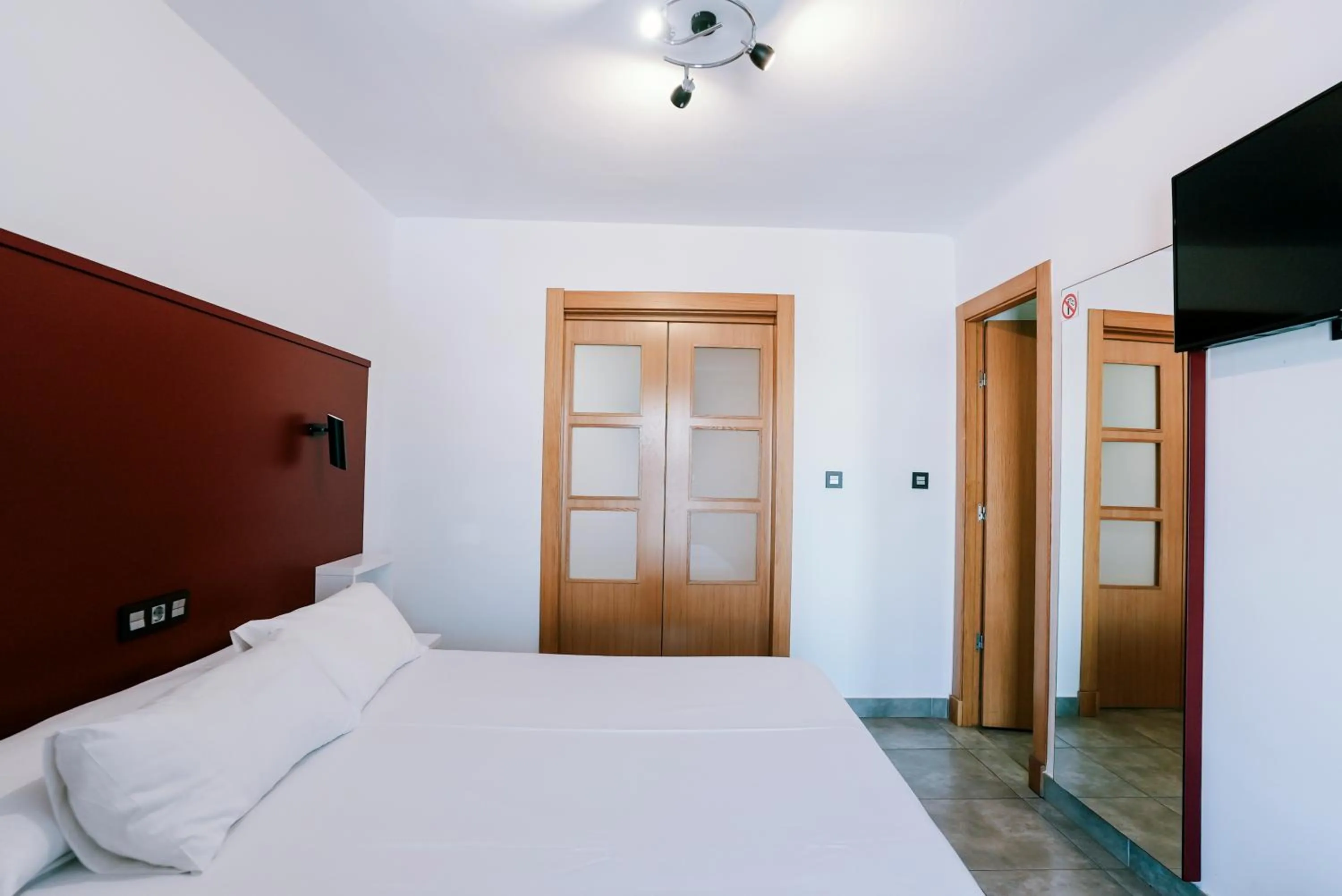 Bed in Hospedium Hotel Continental