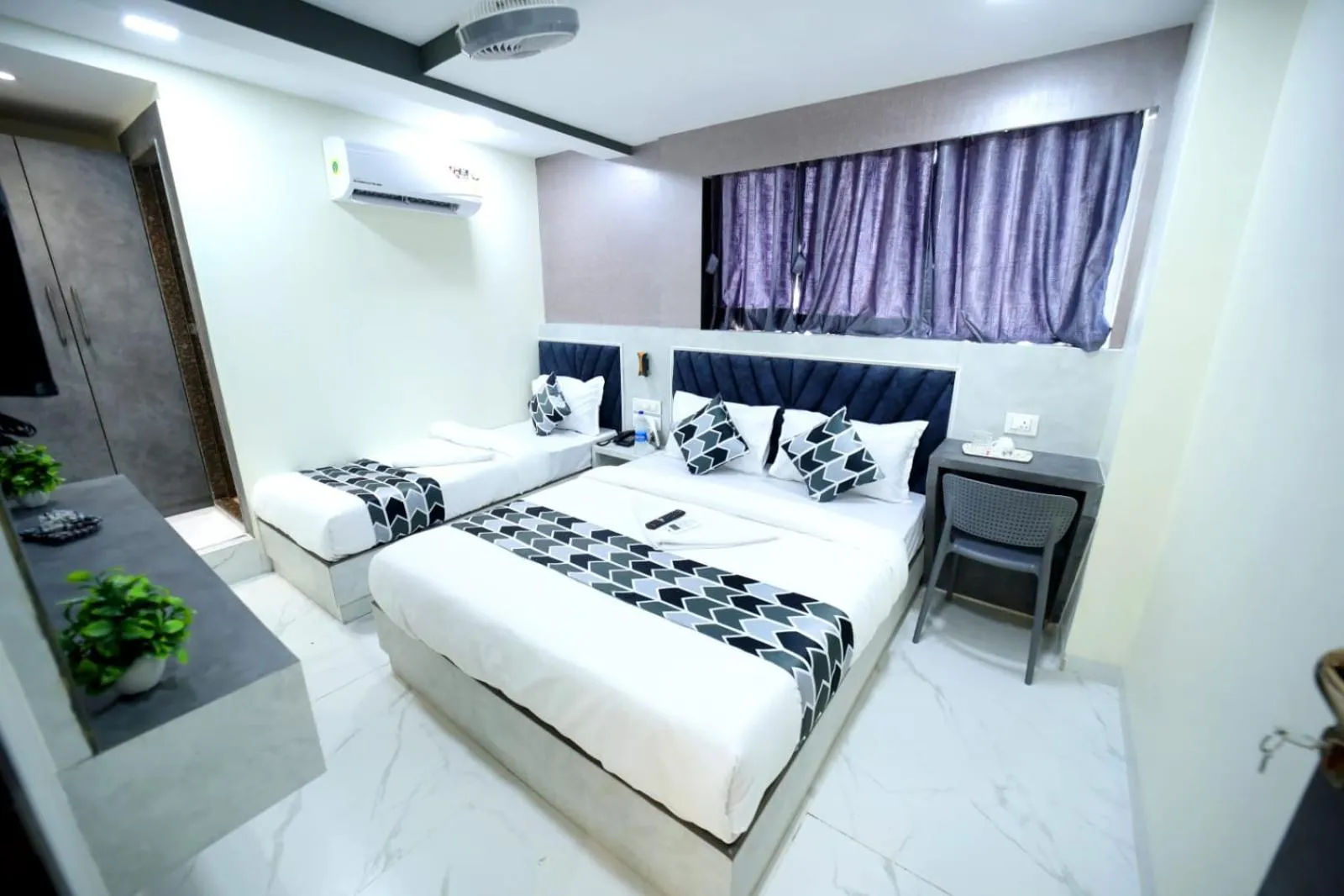 Photo of the whole room, Bed in N.M. Hotel