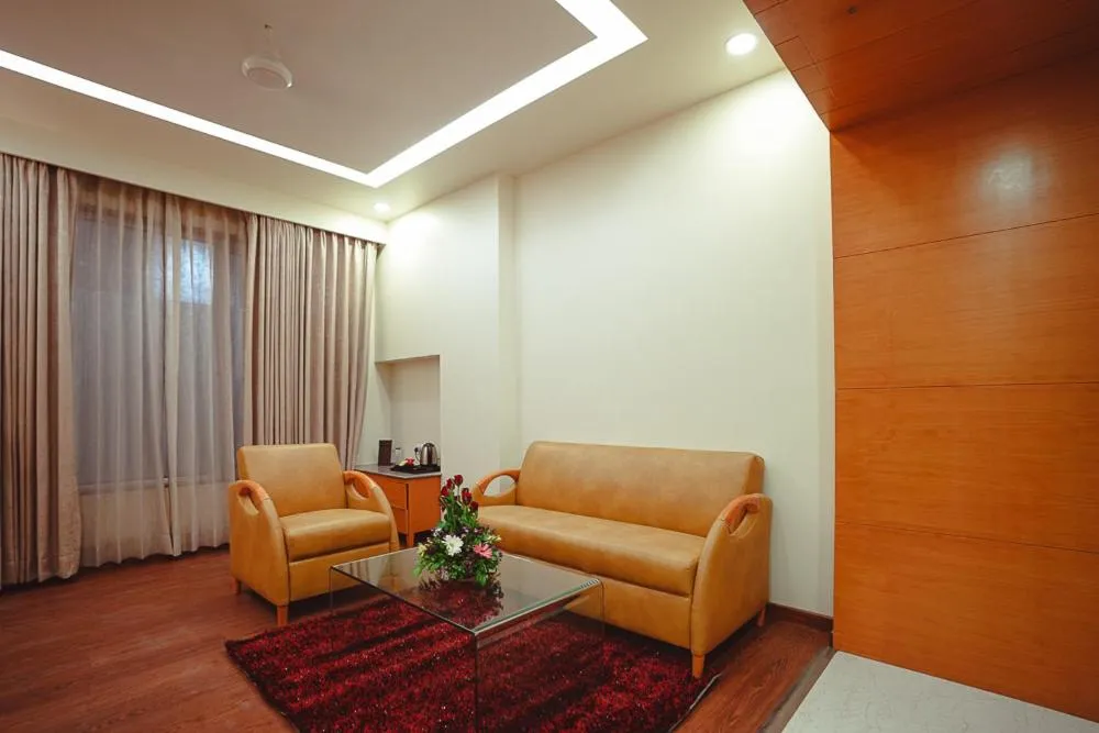 Seating area in Ramee The Srinivas Palace