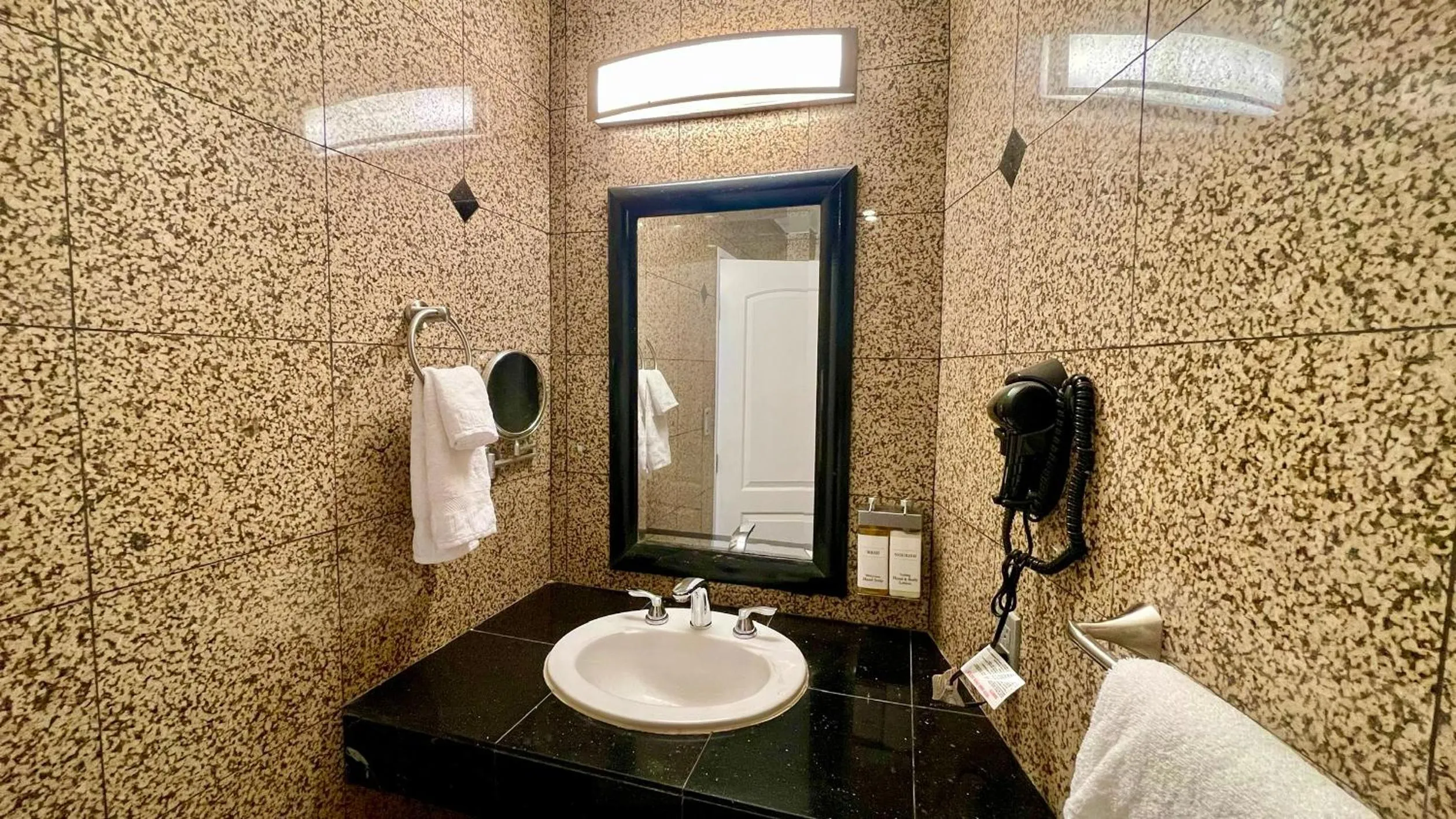 Bathroom in Quintessence ApartHotel