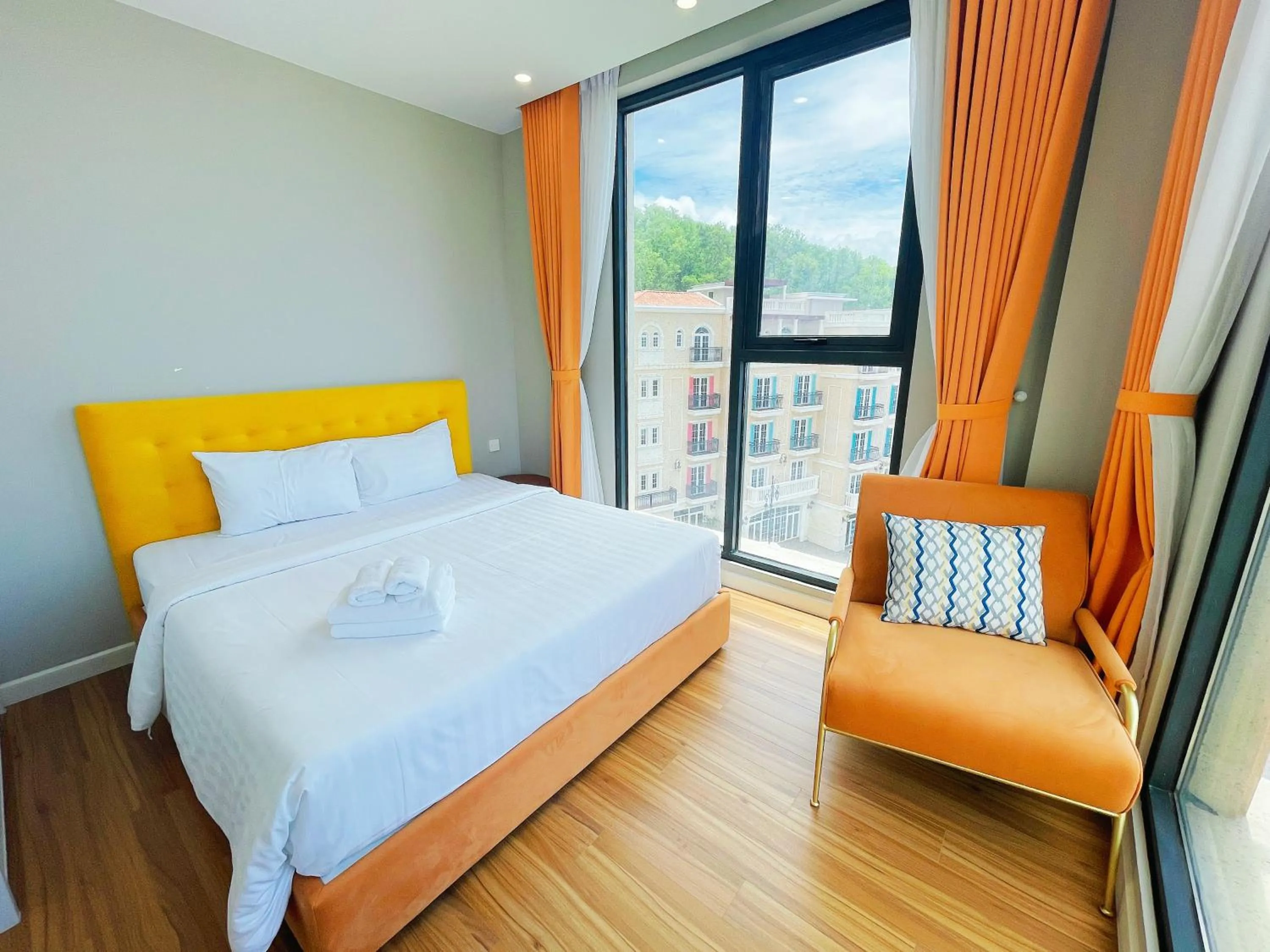 Bedroom, Bed in We Young Apartments by HOFs - Fireworks & Ocean view