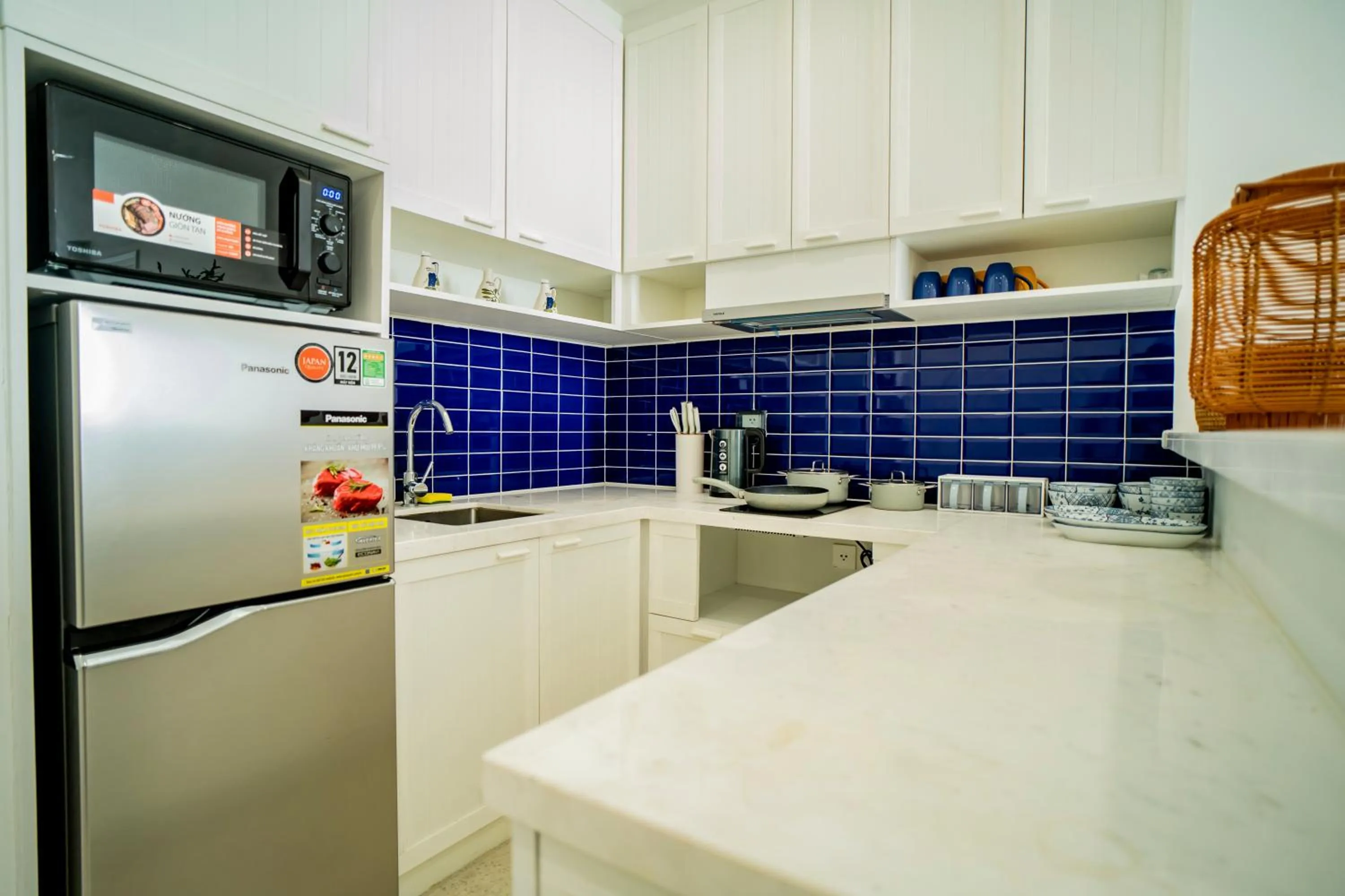 stove in We Young Apartments by HOFs - Fireworks & Ocean view