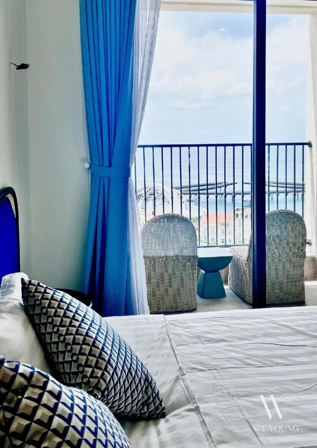 Bed in We Young Apartments by HOFs - Fireworks & Ocean view
