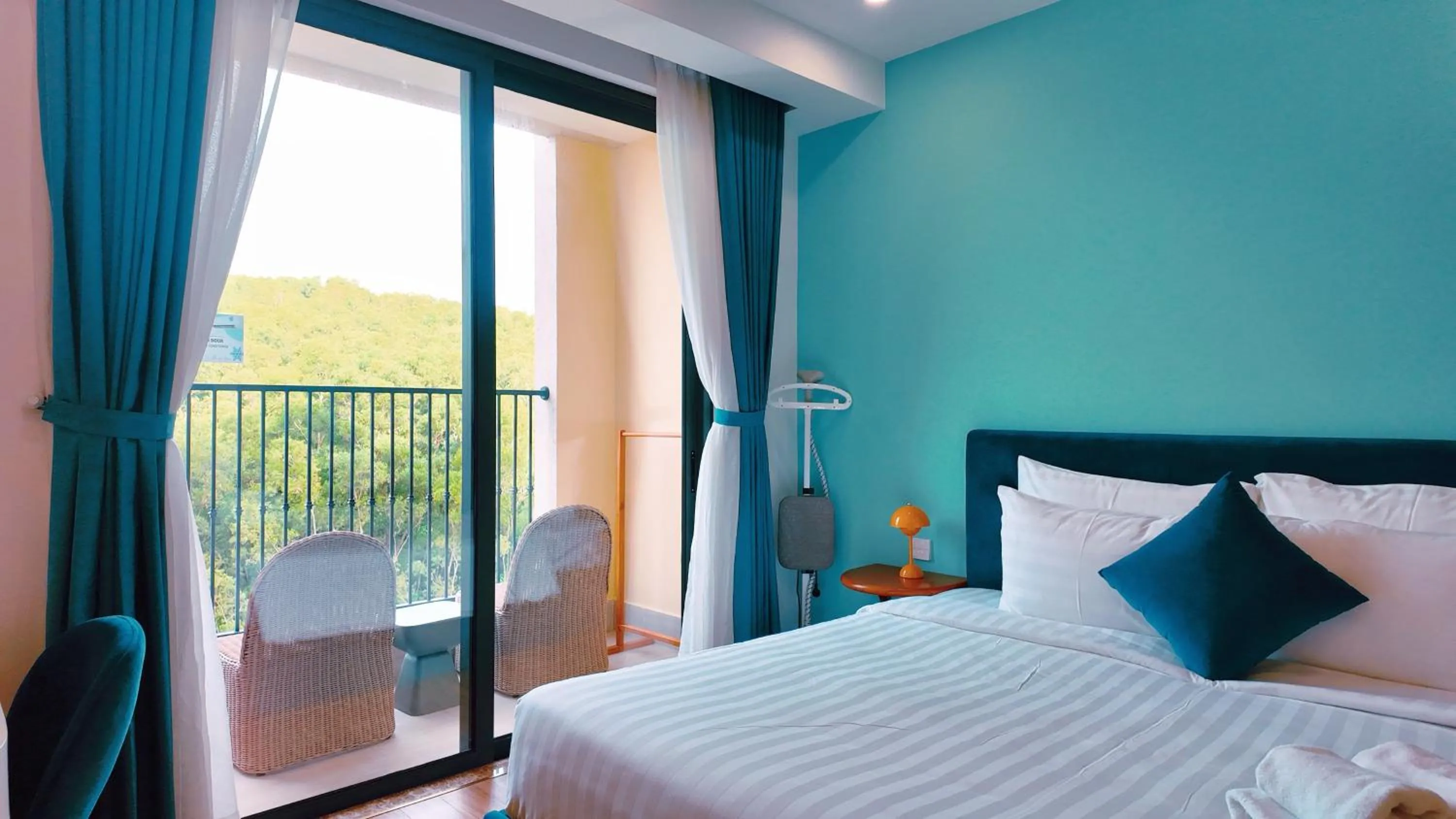 Bedroom, Bed in We Young Apartments by HOFs - Fireworks & Ocean view