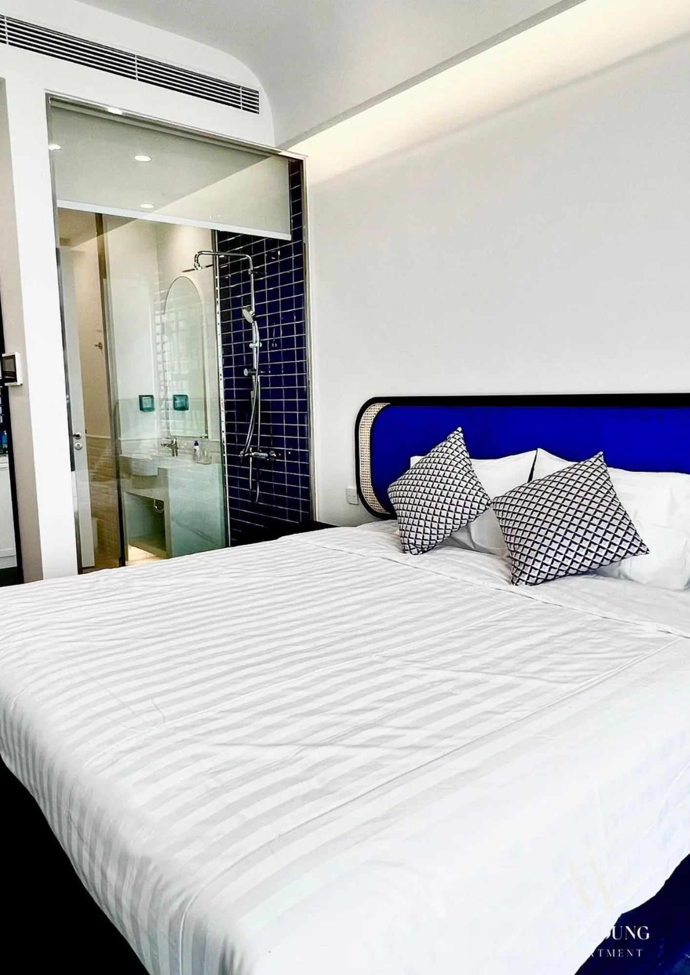 Bed in We Young Apartments by HOFs - Fireworks & Ocean view