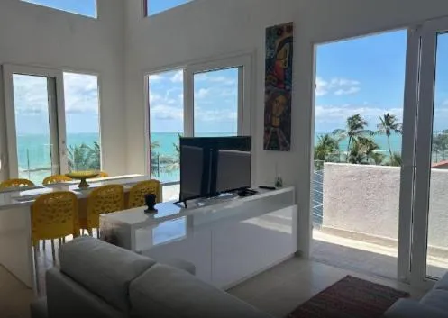 Communal lounge/ TV room in ApartHotel Praia dos Carneiros