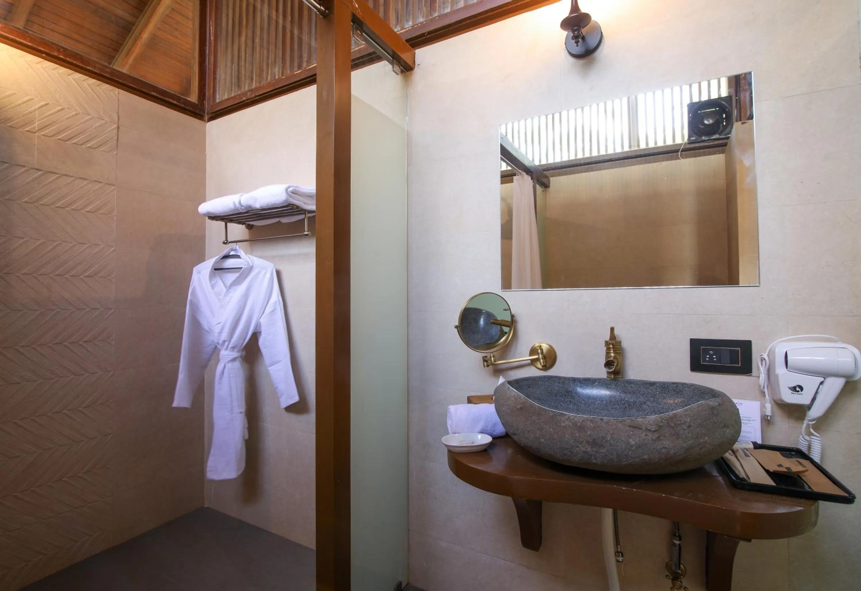 Bathroom in Toyam by Orchid Hotels