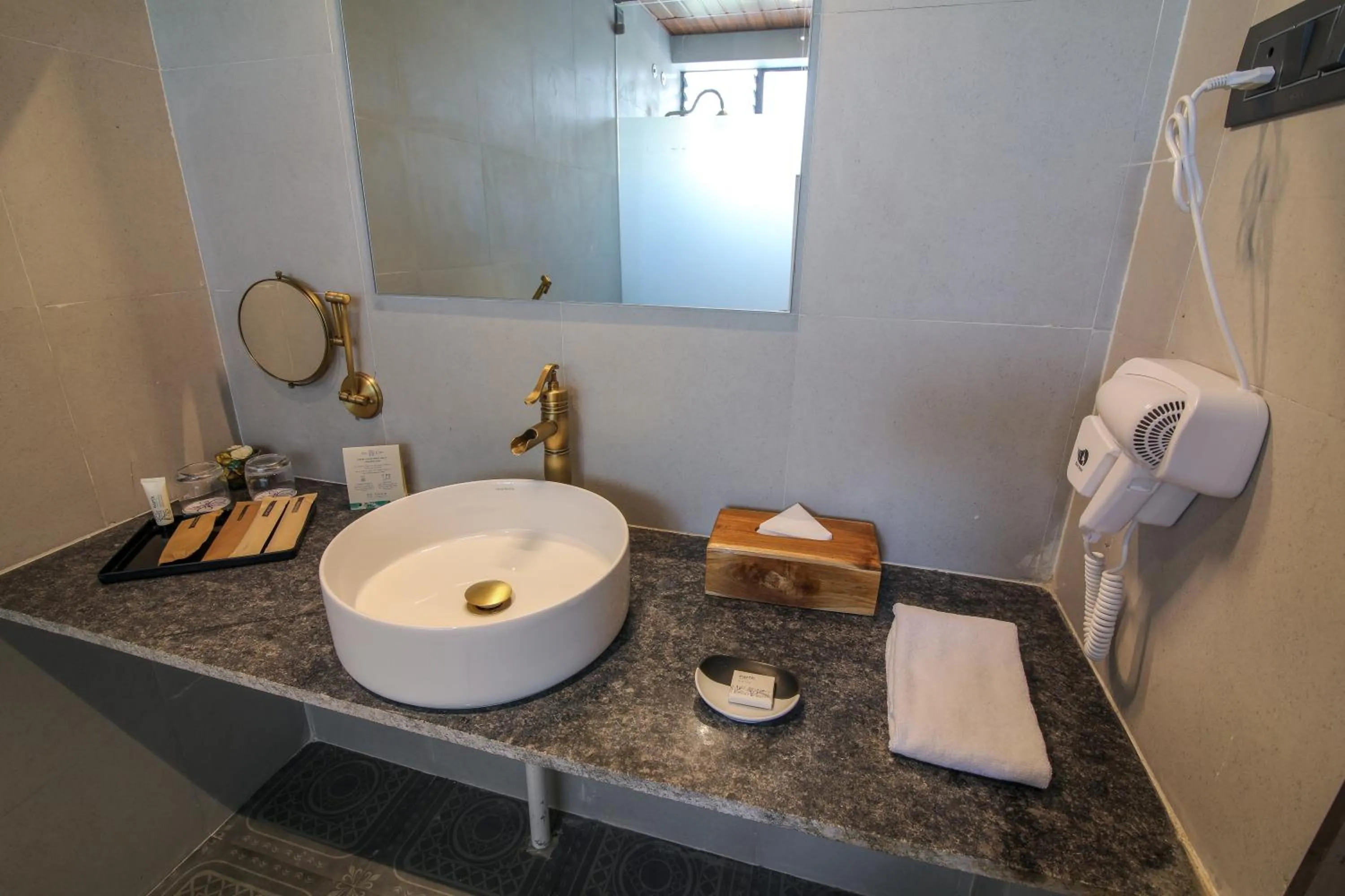 Bathroom in Toyam by Orchid Hotels