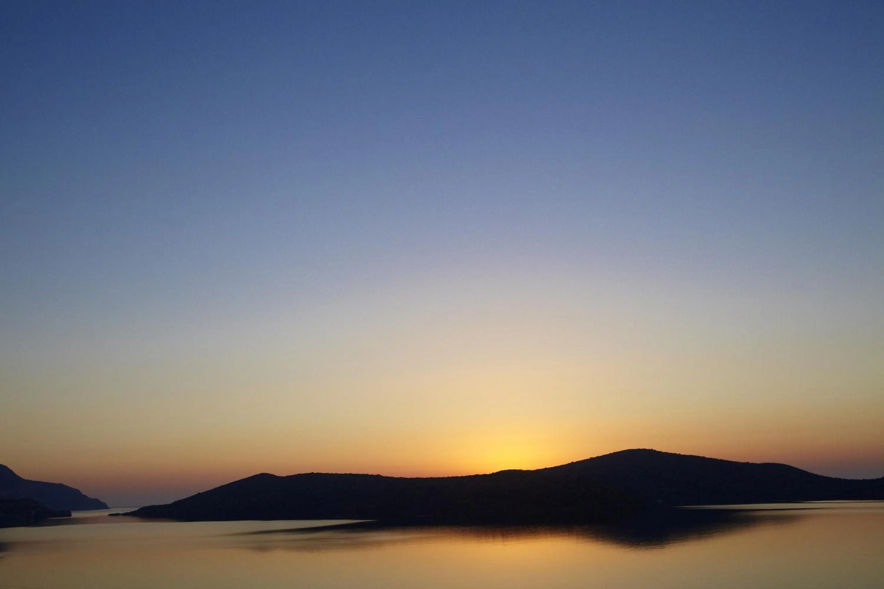 Sunset in Domes Aulus Elounda, Adults only, Curio Collection by Hilton