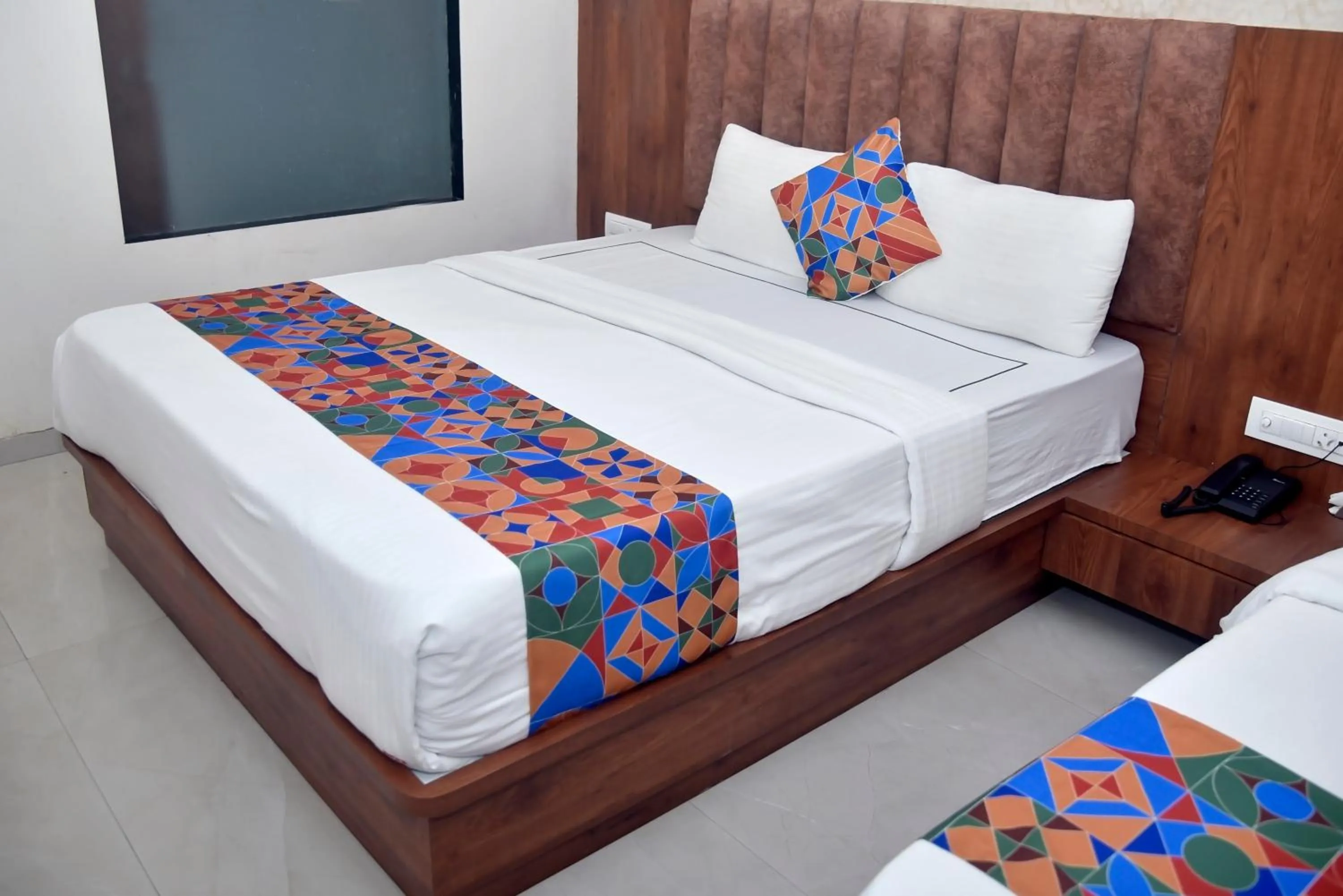 Bed in Hotel Pride Inn