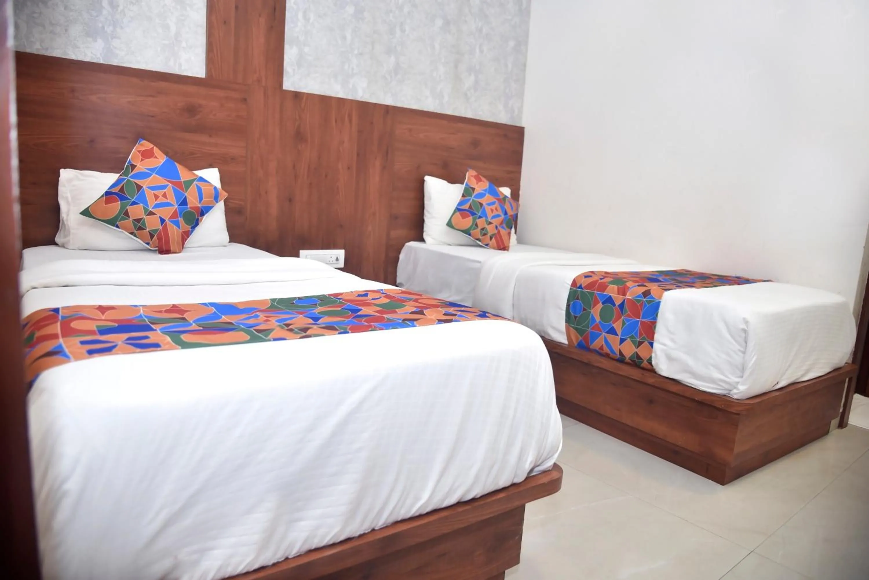 Bed in Hotel Pride Inn