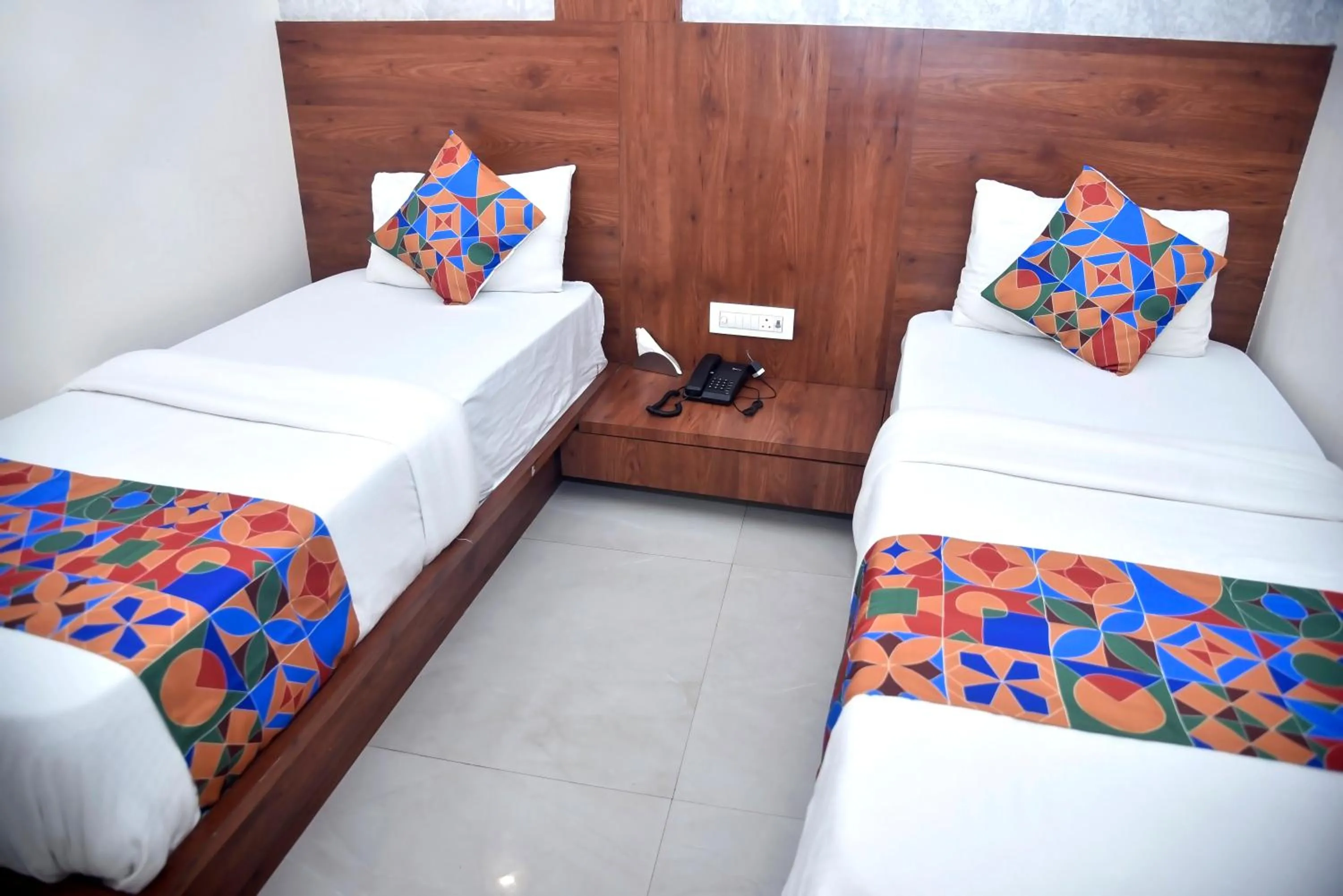 Bed in Hotel Pride Inn