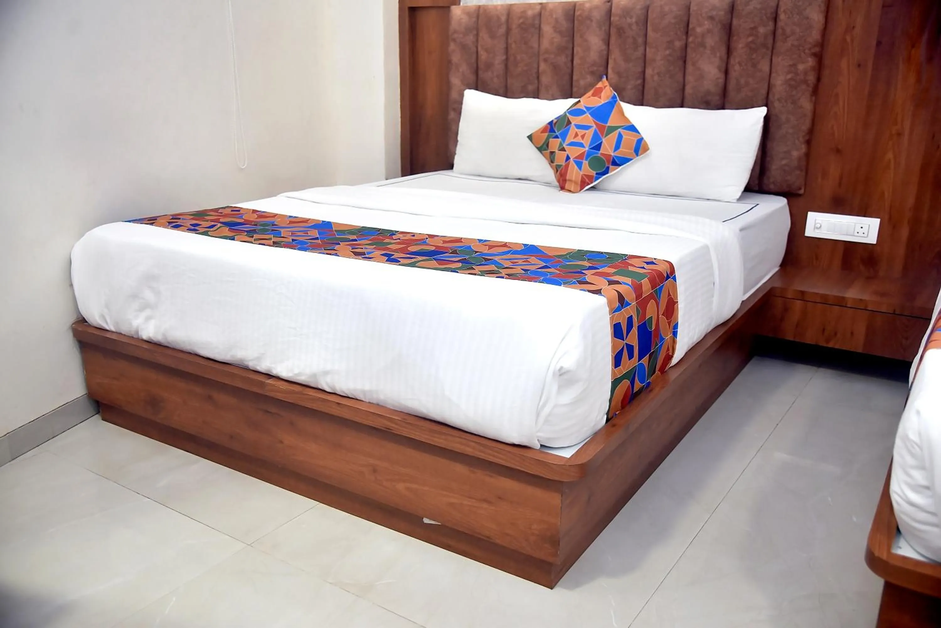 Bed in Hotel Pride Inn