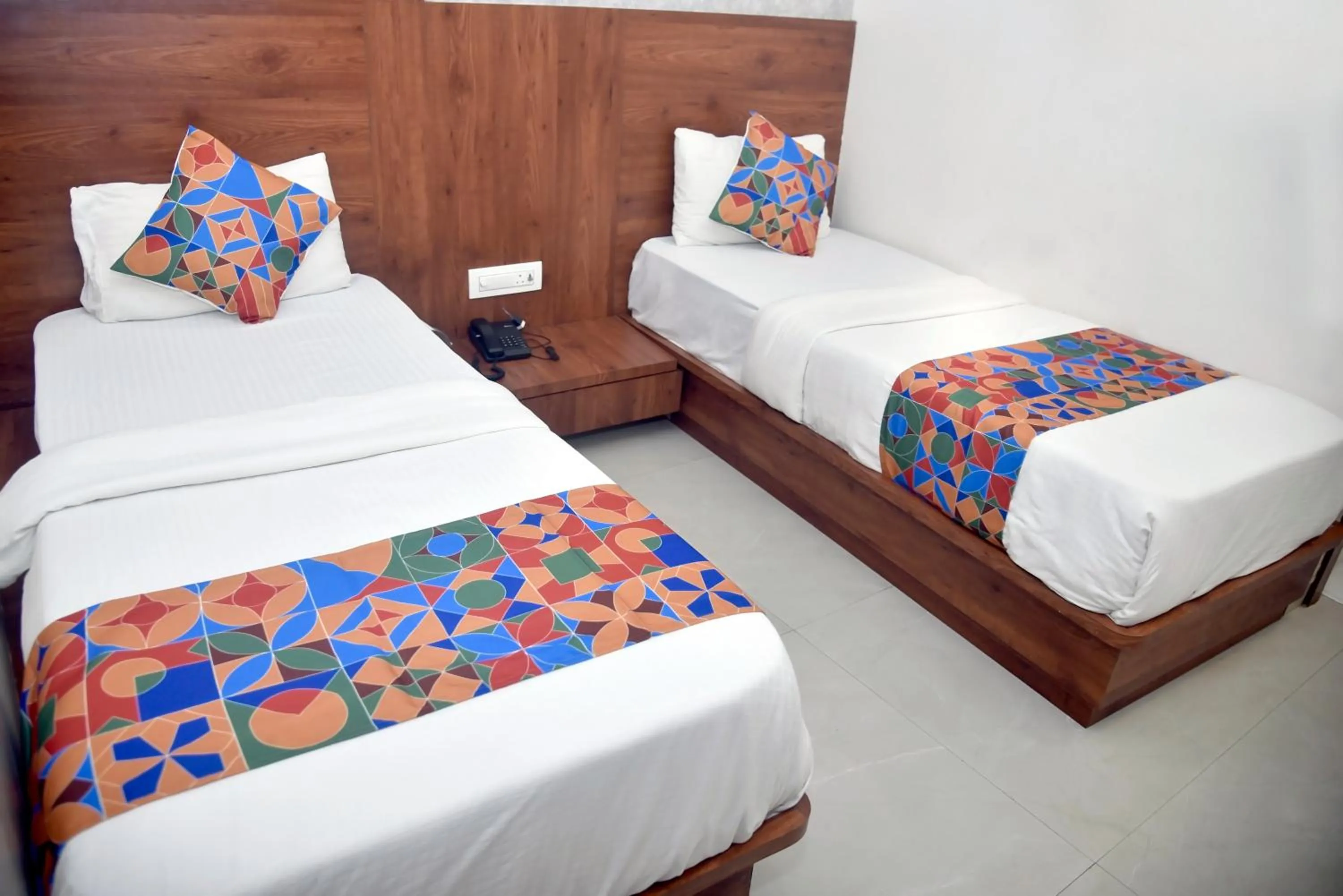 Bed in Hotel Pride Inn