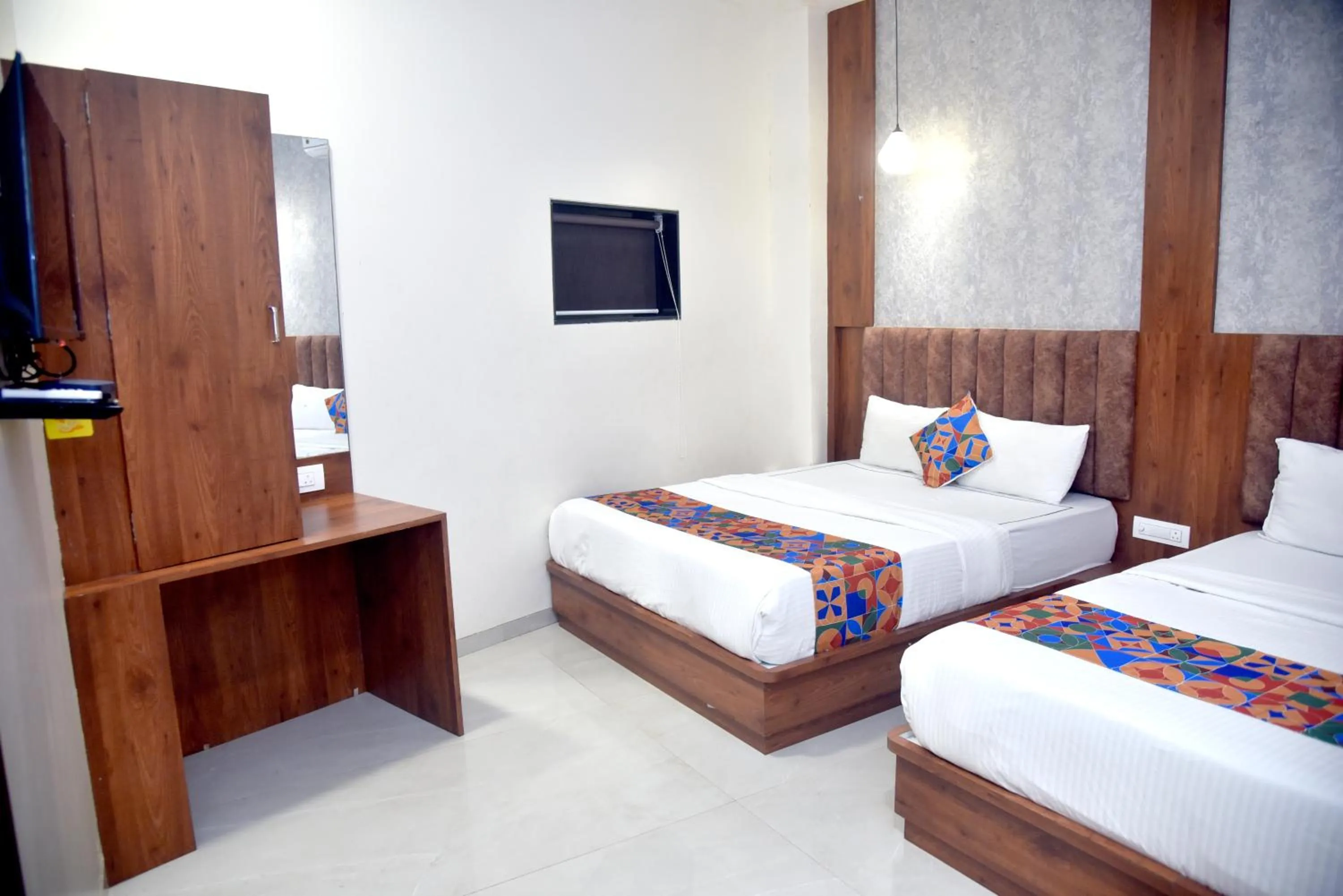 Bed in Hotel Pride Inn